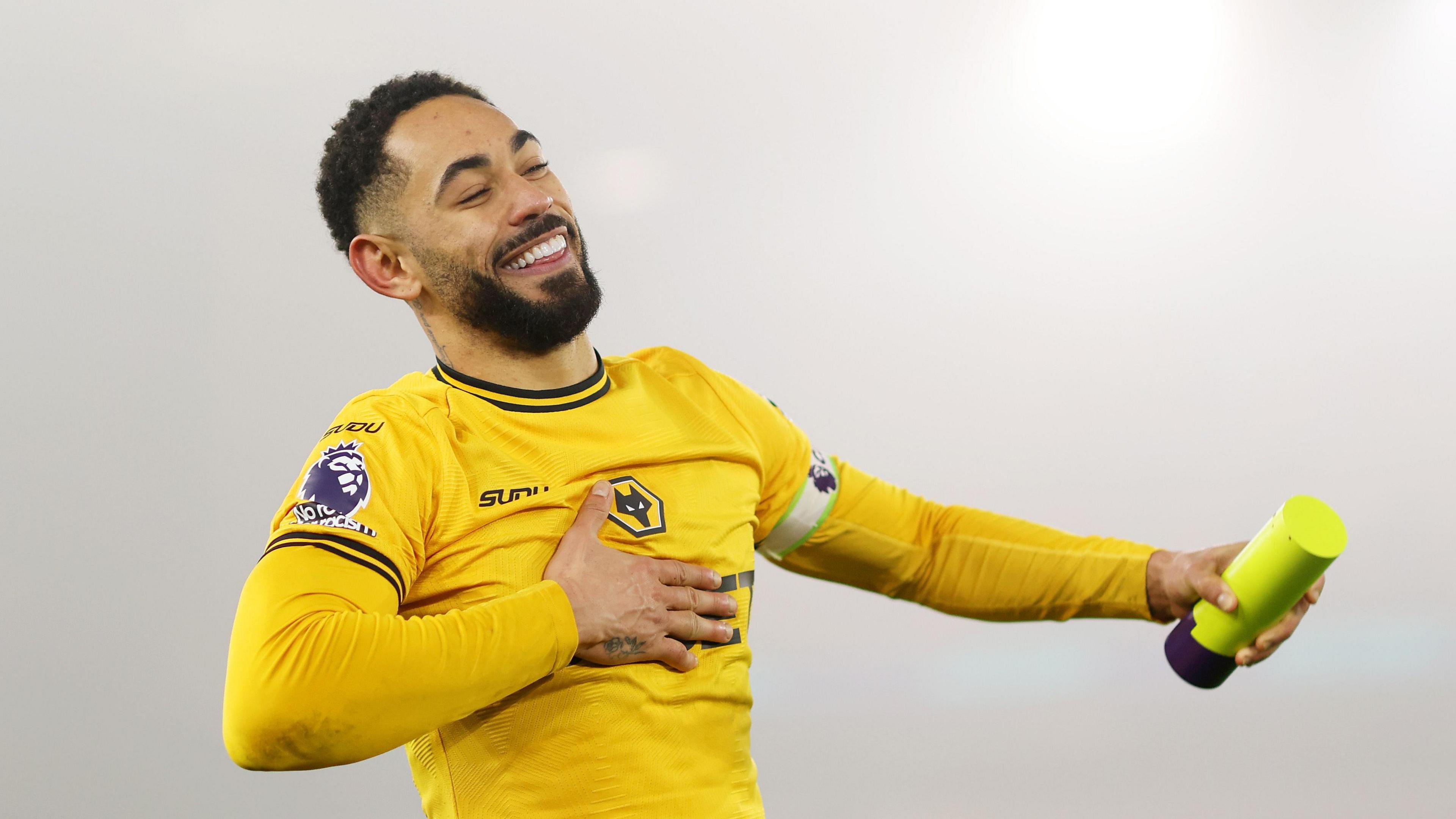 Matheus Cunha celebrates his player of the match award in Wolves' 2-0 win over Manchester United