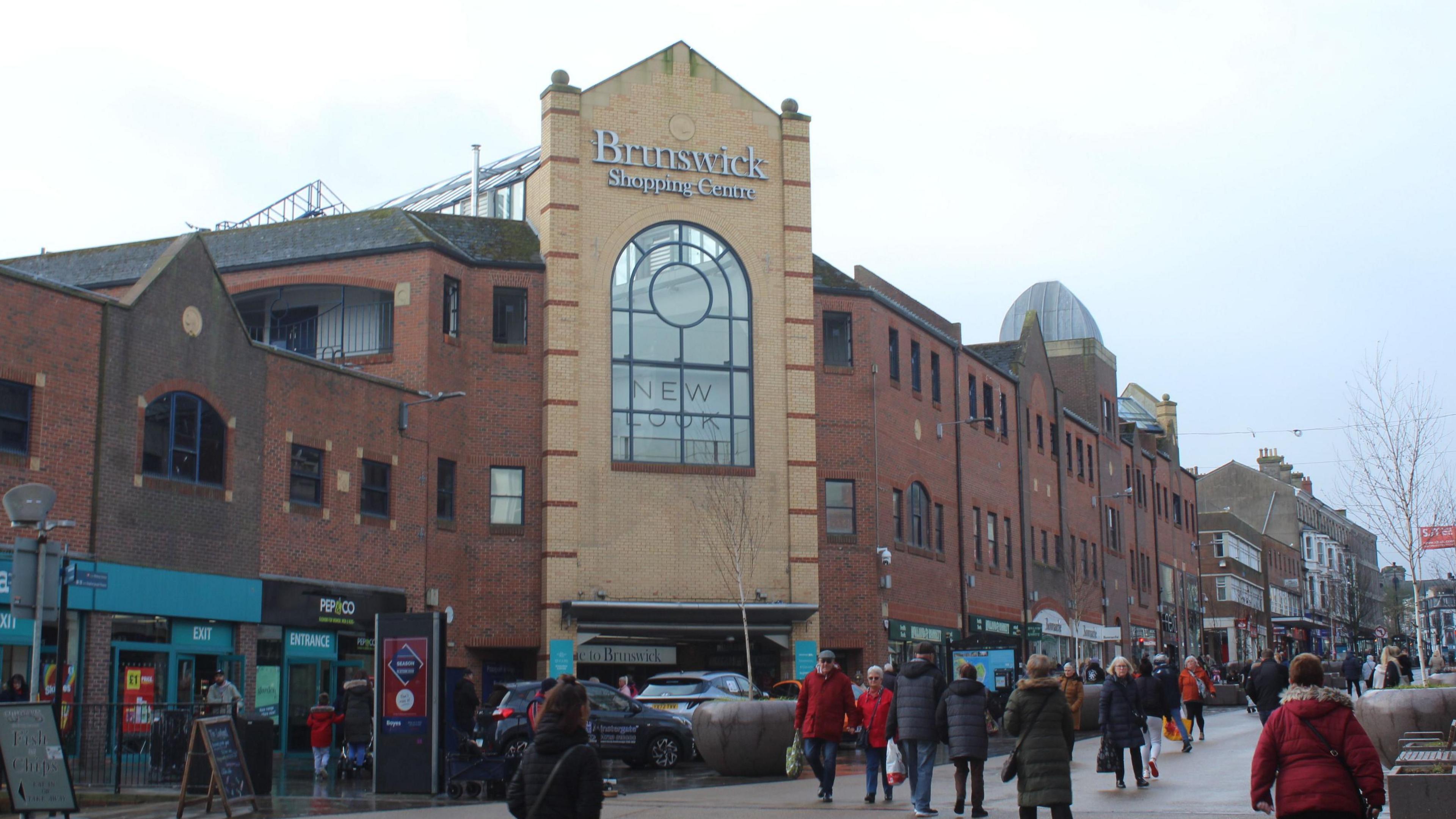 The Brunswick Shopping Centre in Scarborough with shoppers waking past