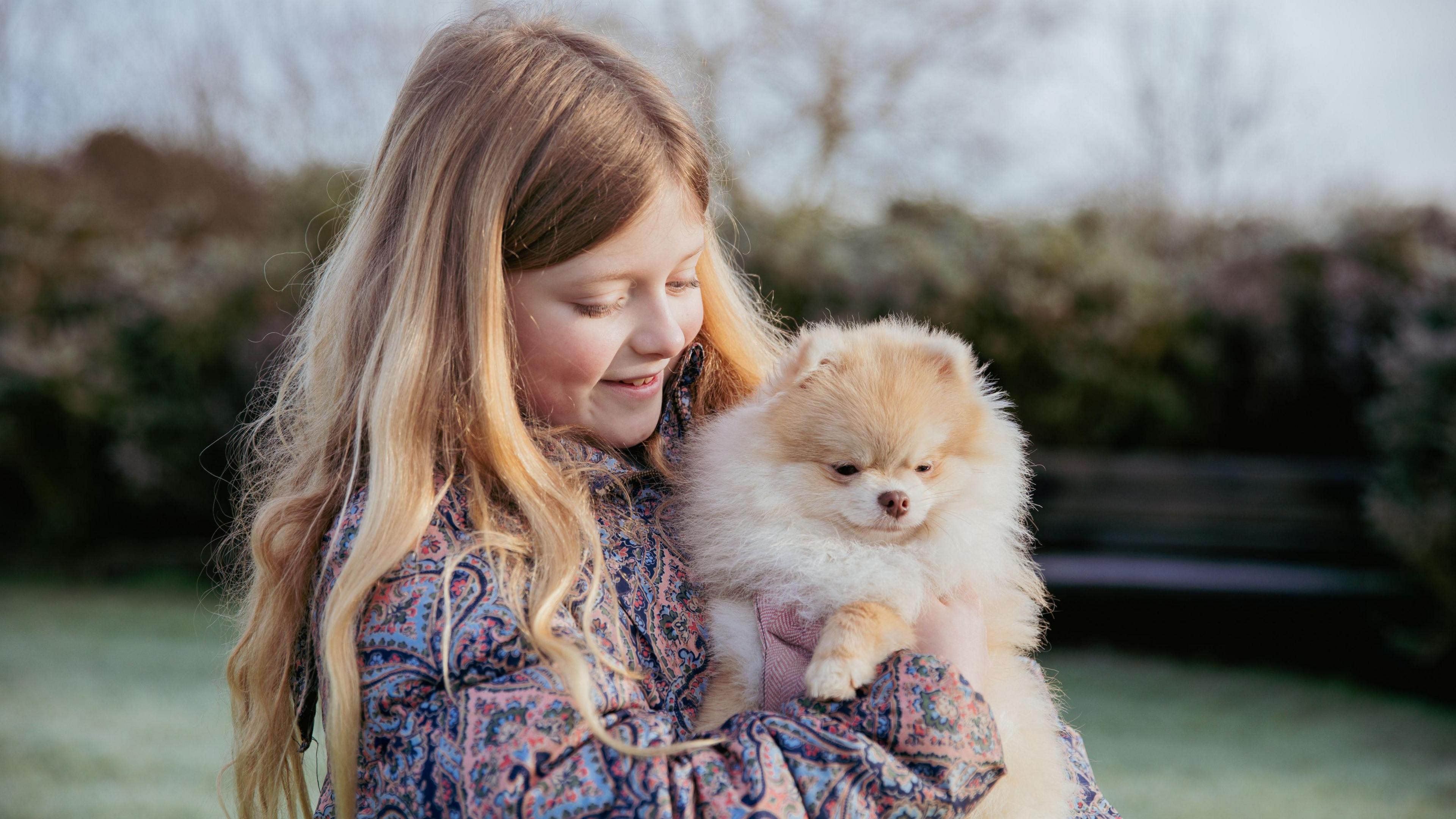 Eight-year-old Rozalyn and her dog Rosa 