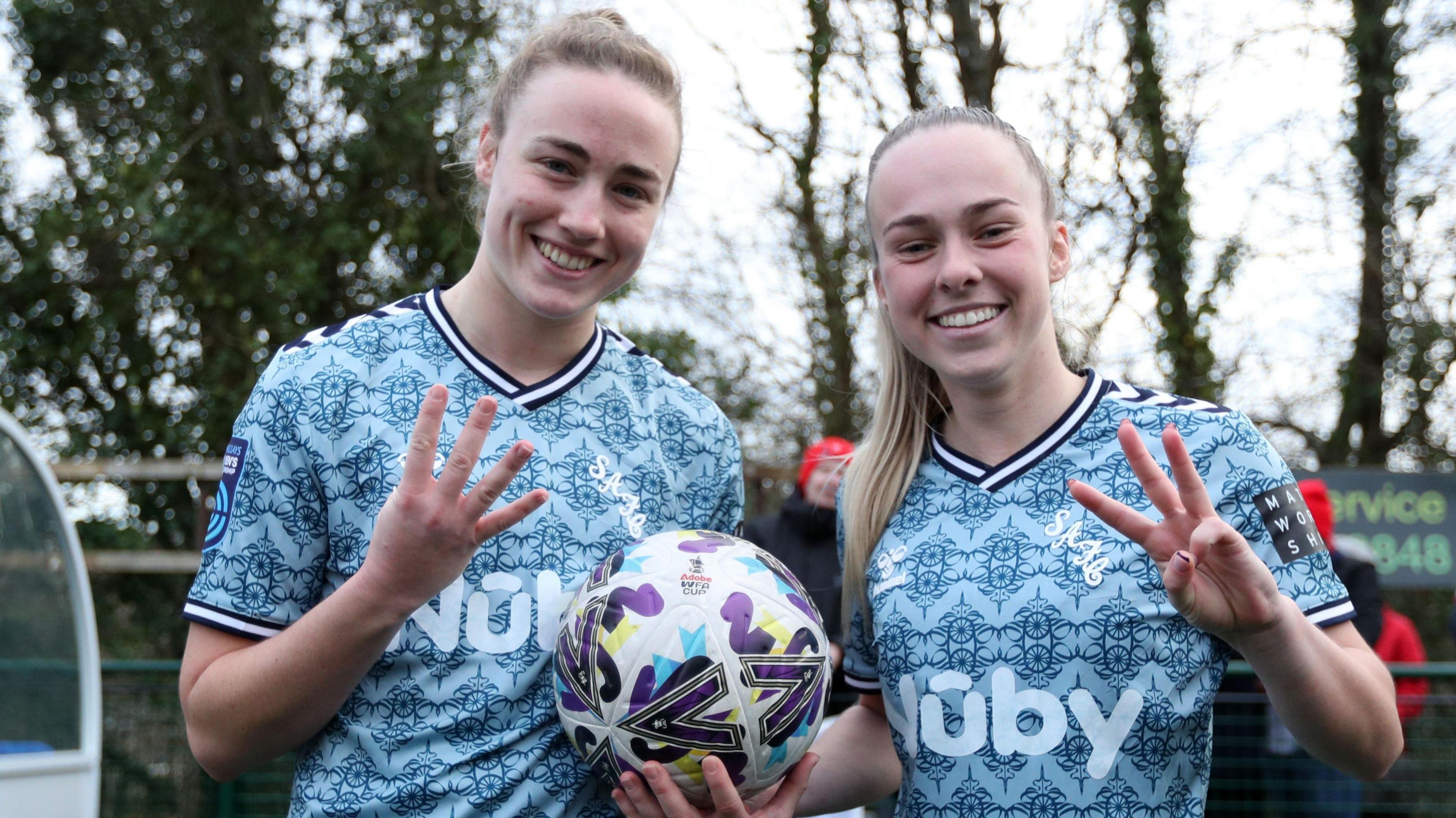 Sunderland's Eleanor Dale and Ellen Jones celebrate scoring four and three goals respectively against Exeter City in the Women's FA Cup fourth round