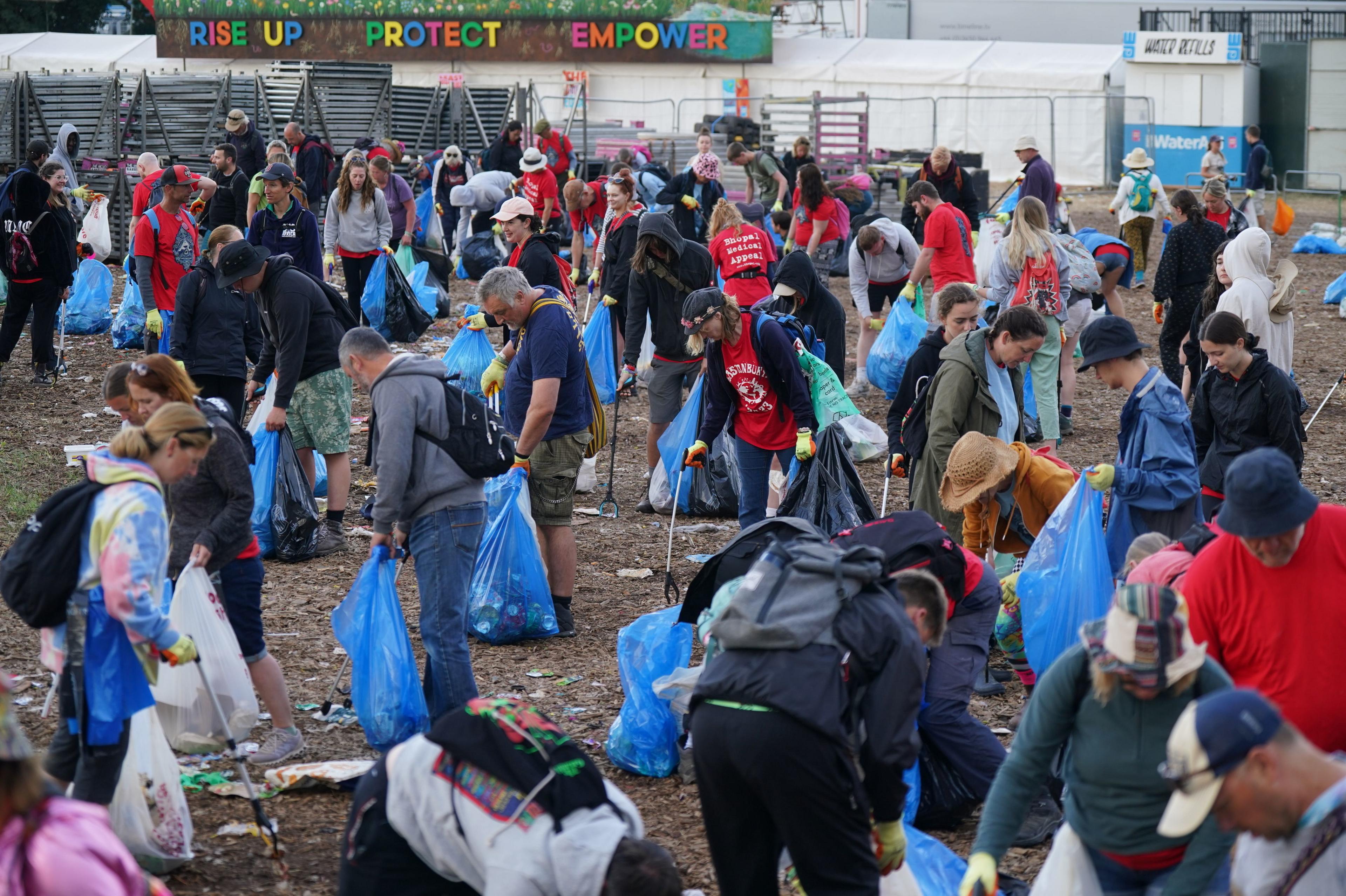 People seen during the clean up operation at the Glastonbury Festival at Worthy Farm in Somerset.