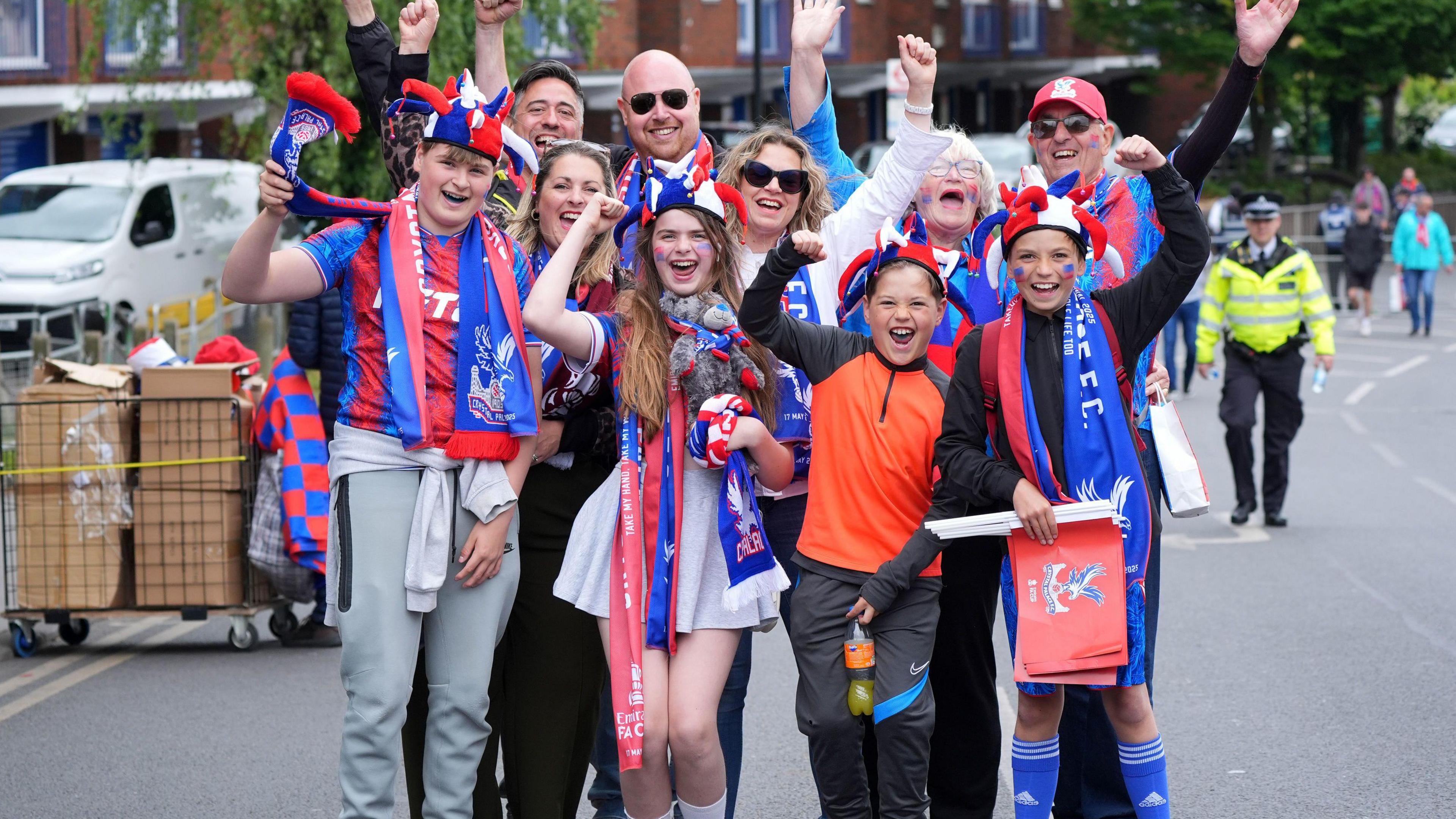 A group of fans posing for a photo