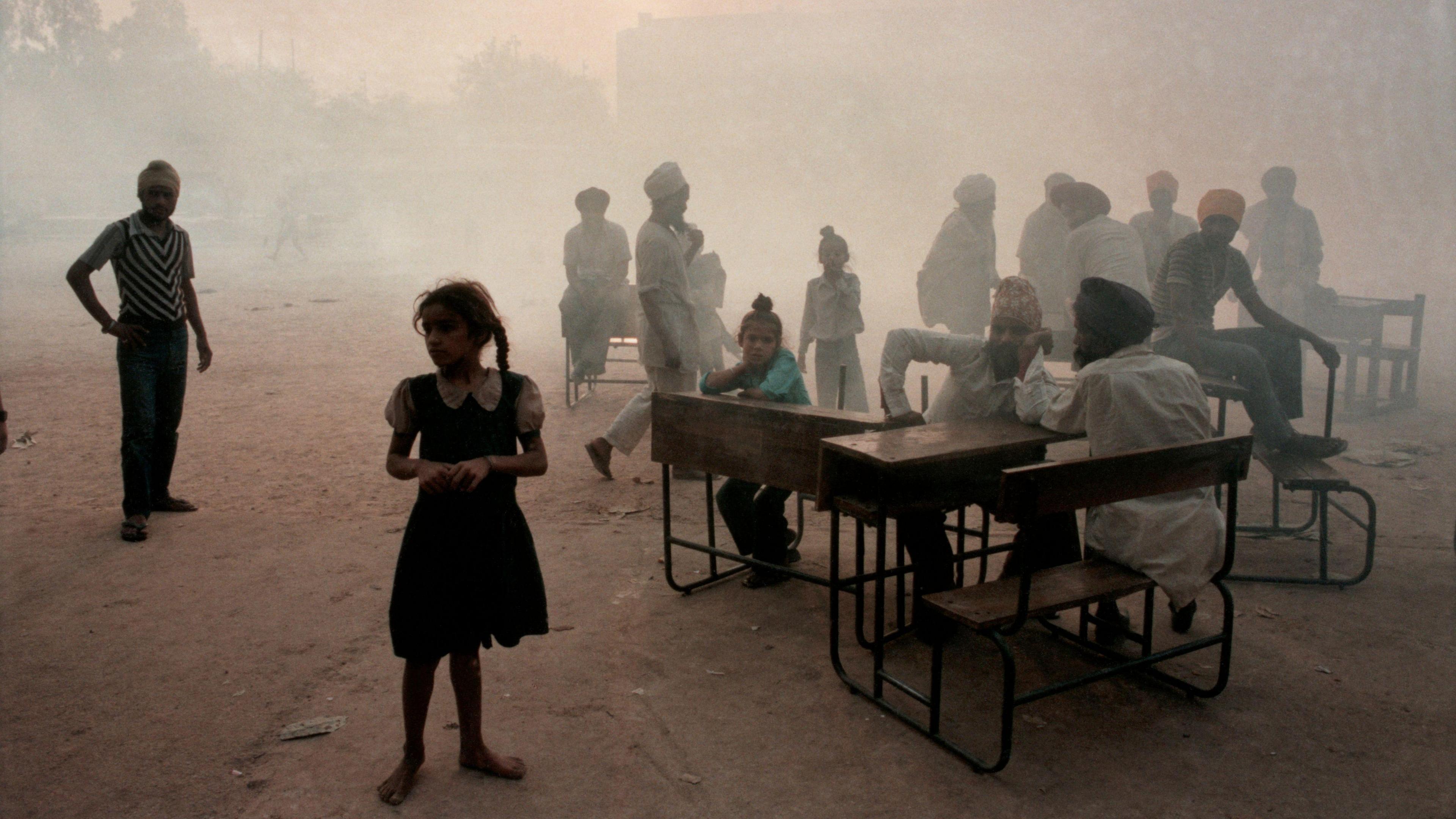 Sikh refugees gather in a New Delhi schoolyard, seeking shelter in the turbulent days following the assassination of Prime Minister Indira Gandhi. Gandhi was shot to death by two of her own Sikh bodyguards in an act of retaliation for an Indian Army attack on a Sikh temple. (Photo by David Turnley/Corbis/VCG via Getty Images)
