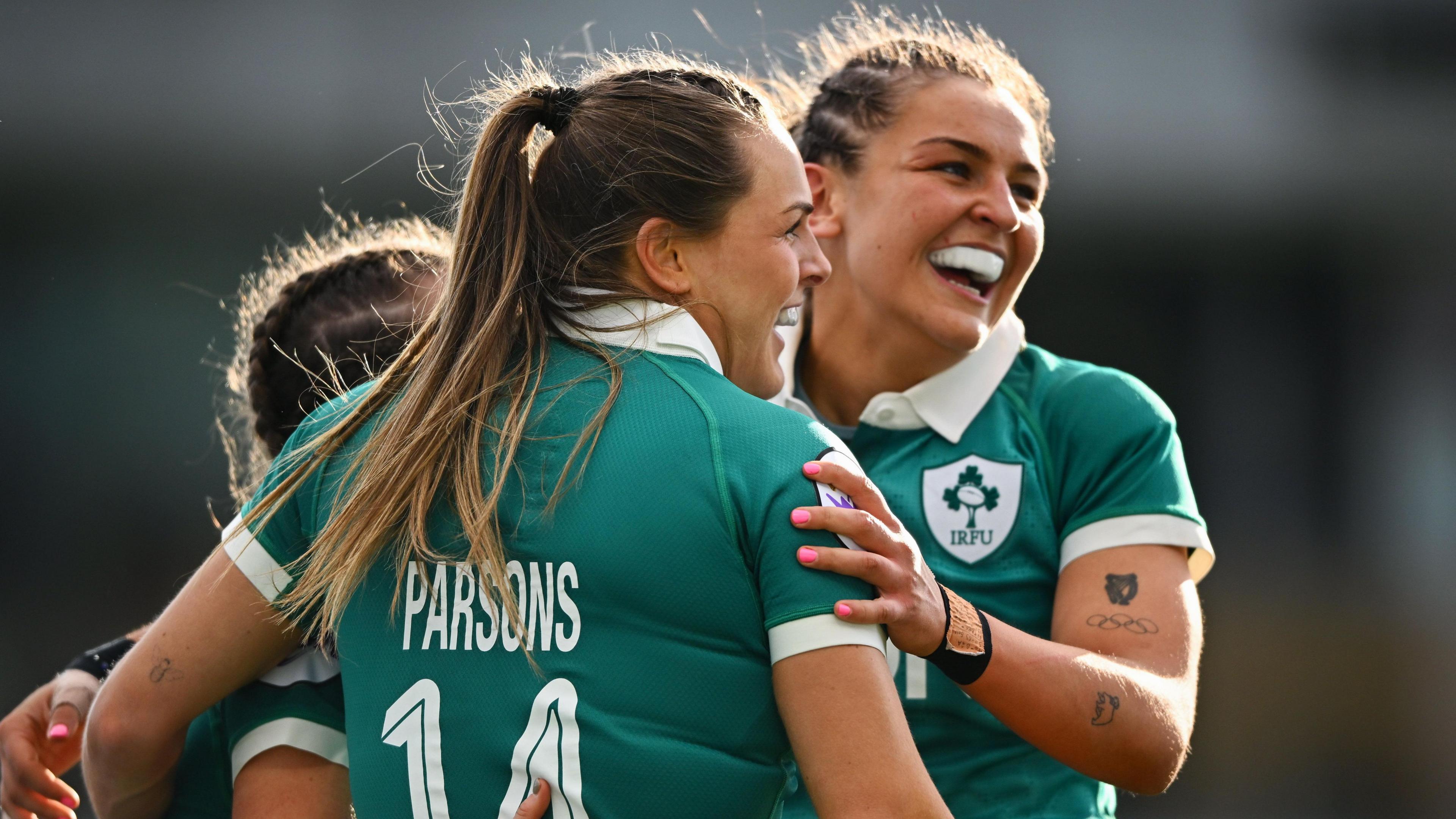 Beibhinn Parsons celebrates with Ireland captain Erin King