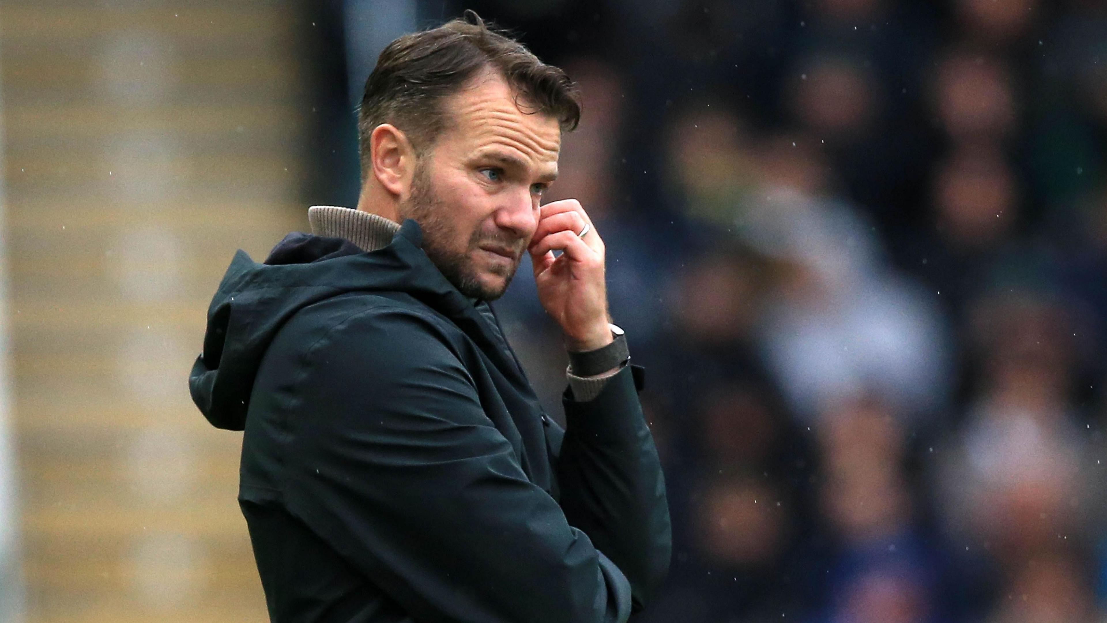 Tom Cleverley looks pensive on the touchline