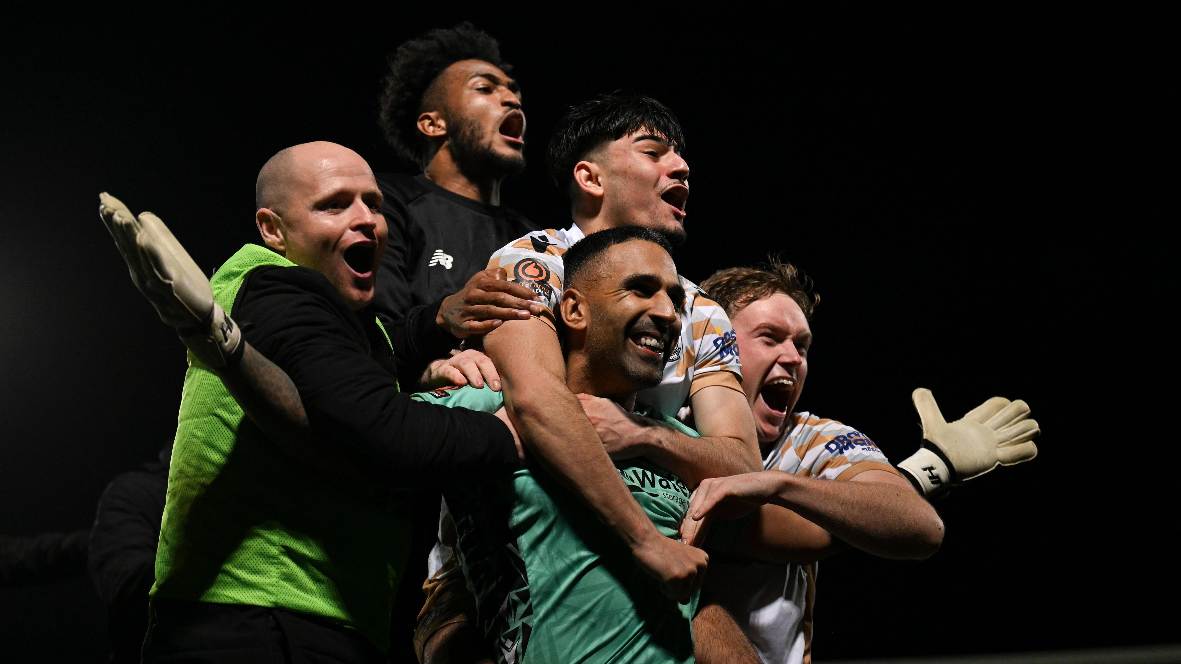 Tamworth keeper Jas Singh and his team-mates celebrate their penalty shootout win over Burton