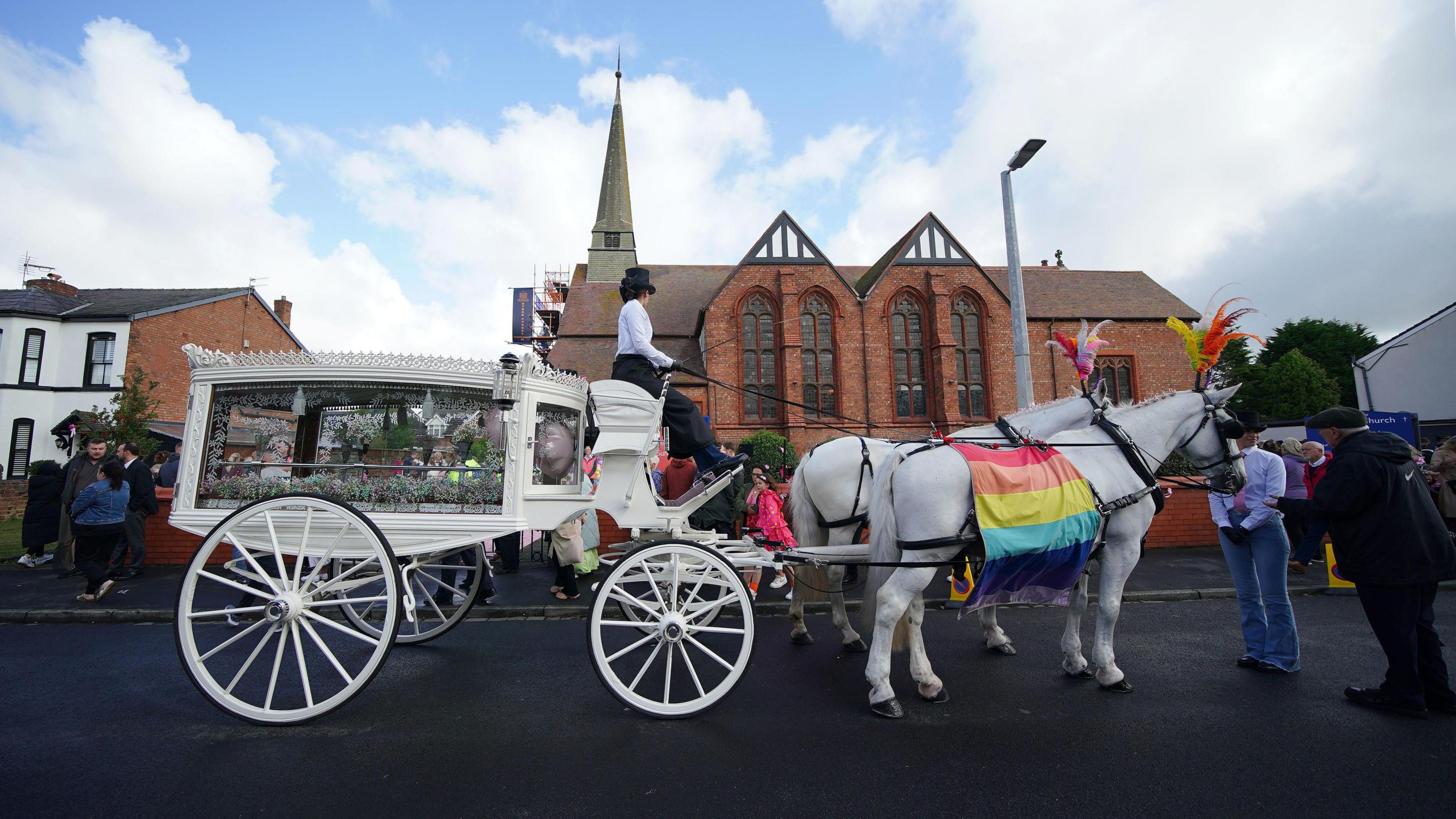 The white horse drawn carriage outside St John's Church in Birkdale