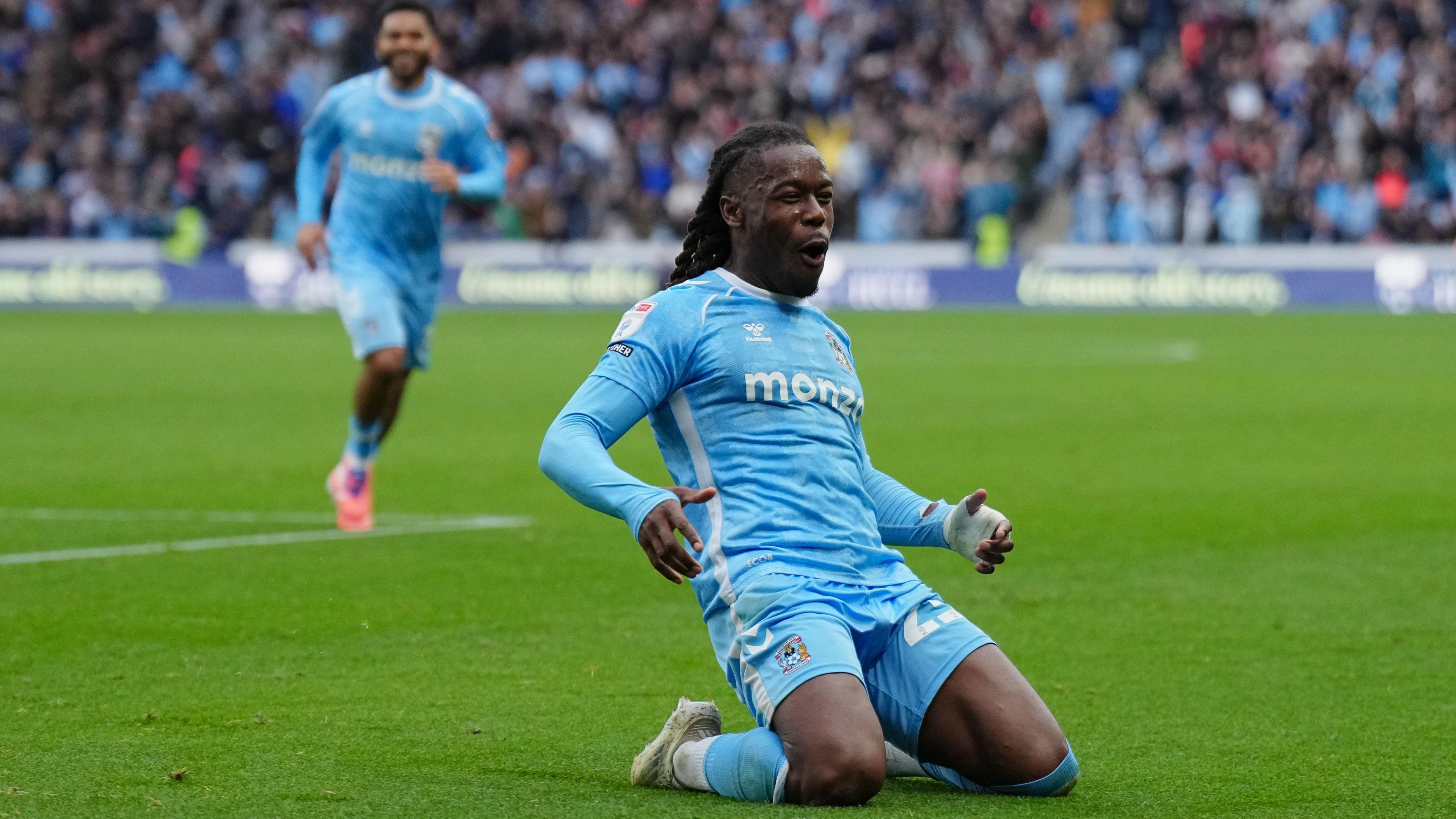 Brandon Thomas-Asante slides on his knees in celebration after scoring for Coventry