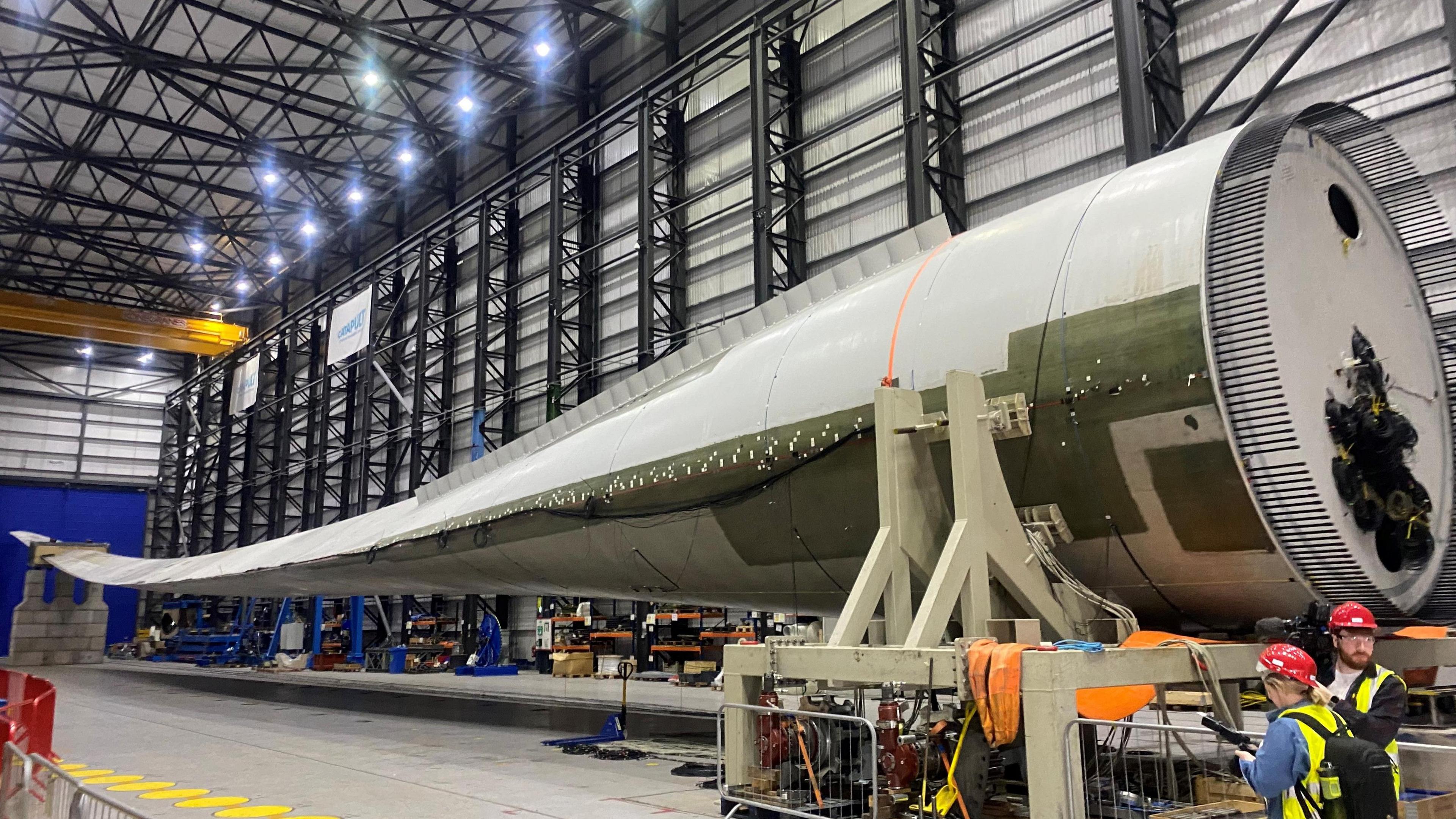 A wind turbine blade in a factory