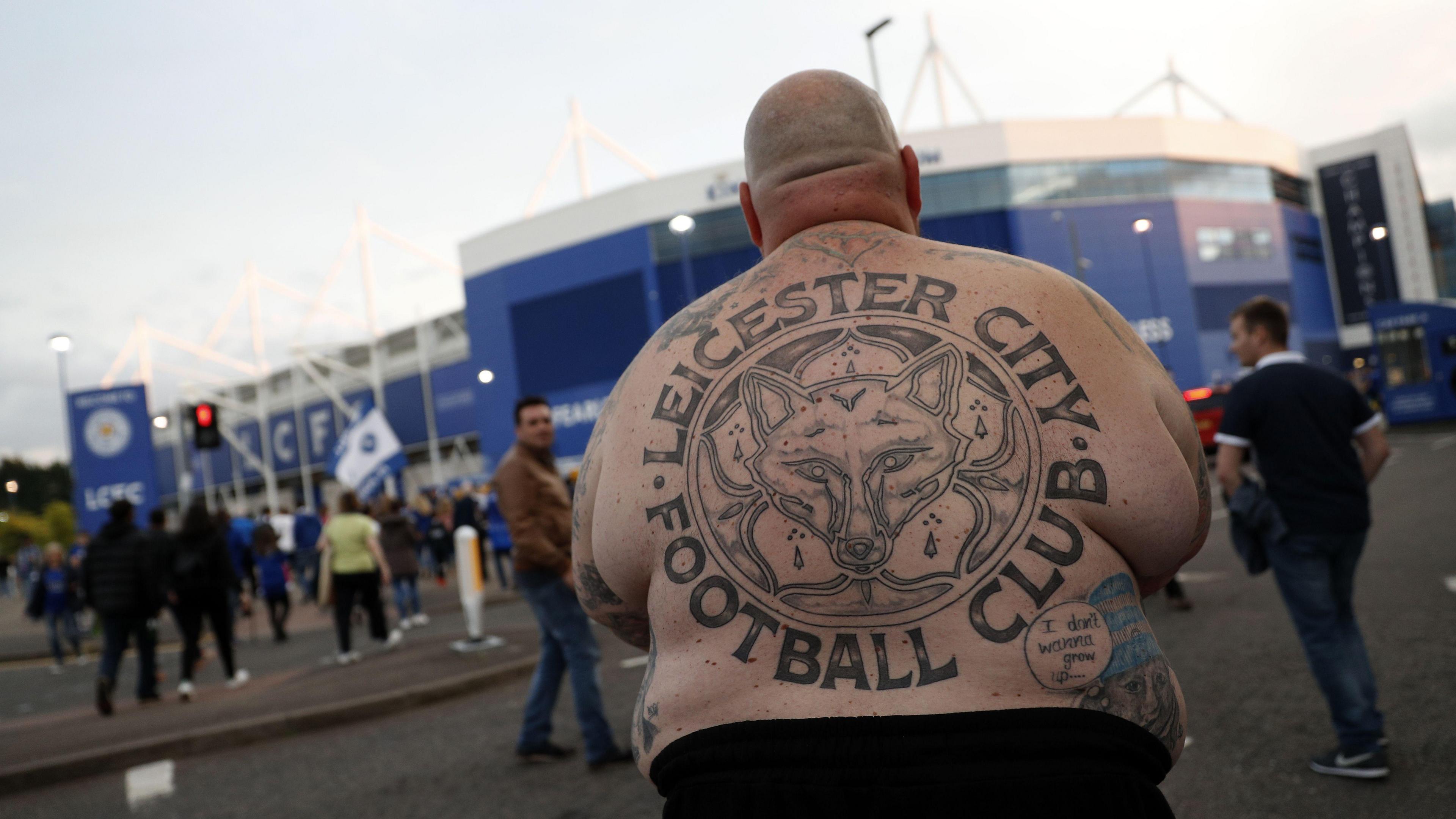 Lee Jobber, faced away from the camera with a Leicester City tattoo on his back