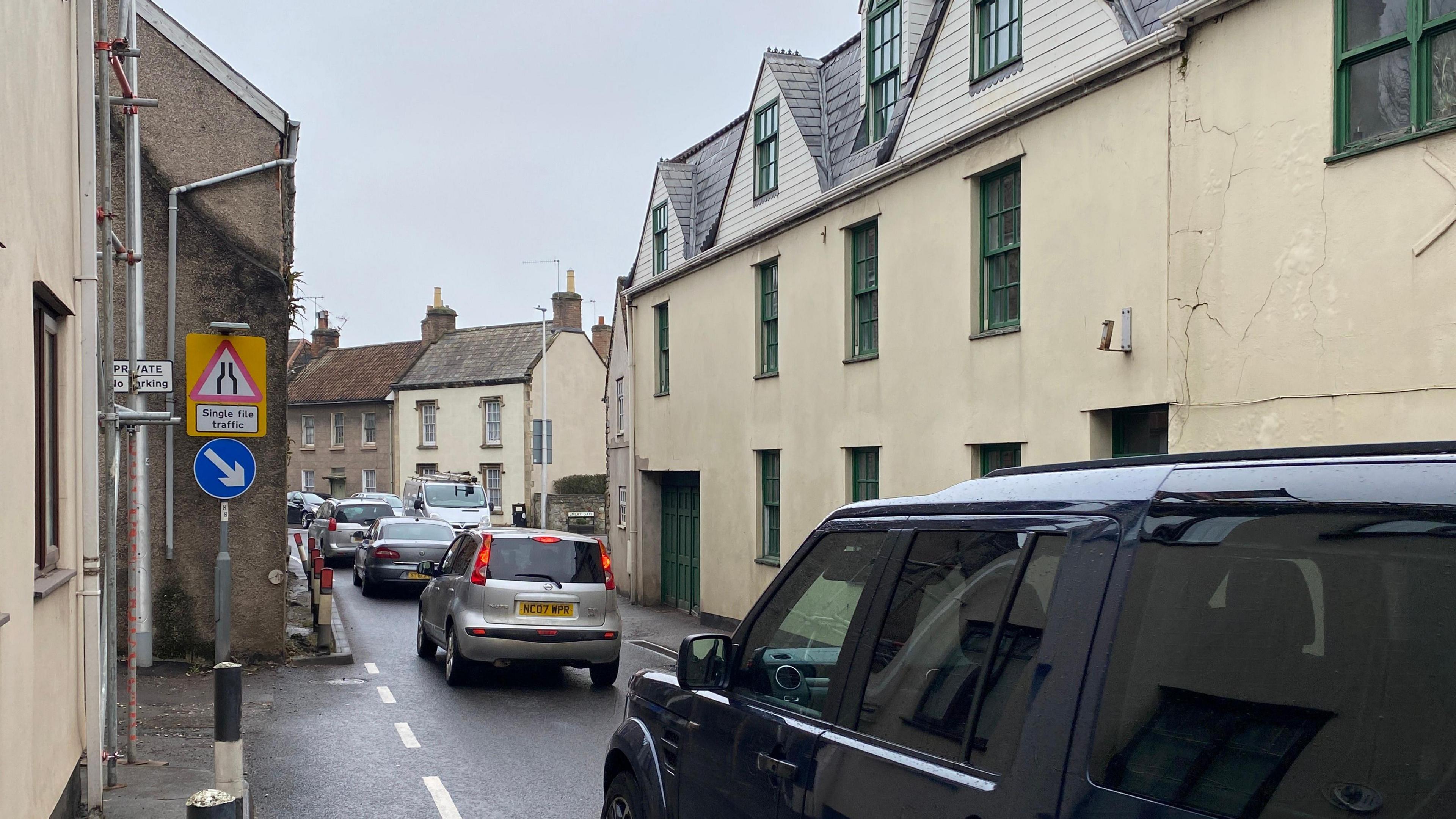 Congestion in Banwell. Lots of cars can be seen queuing in the village