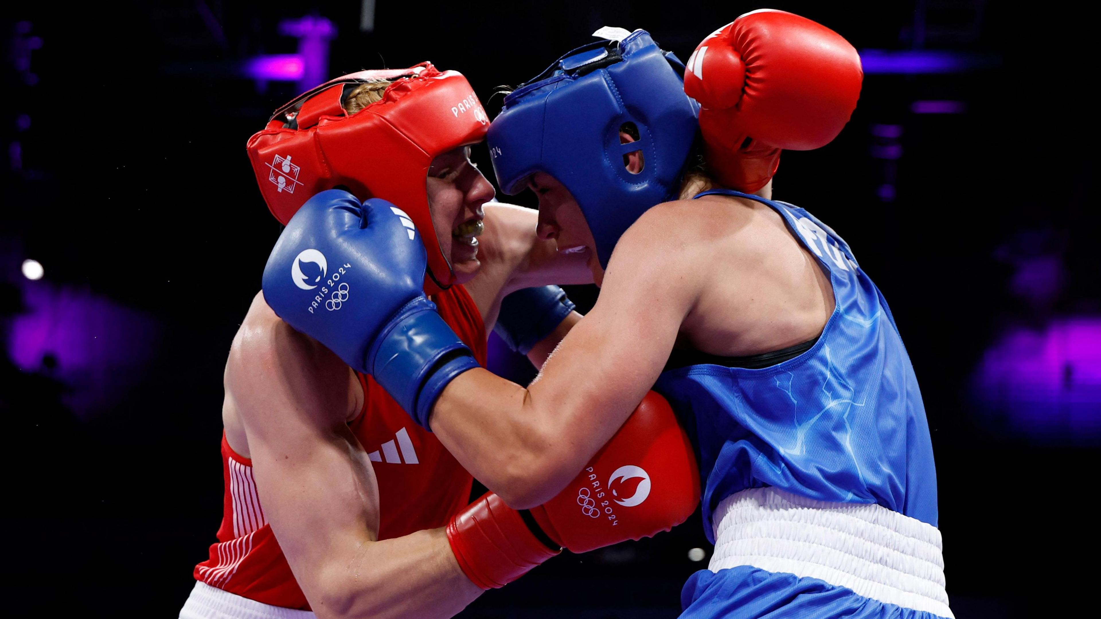 Great Britain's Rosie Eccles (L) fights Poland's Aneta Rygielska in the women's 66kg boxing at the 2024 Paris Olympics