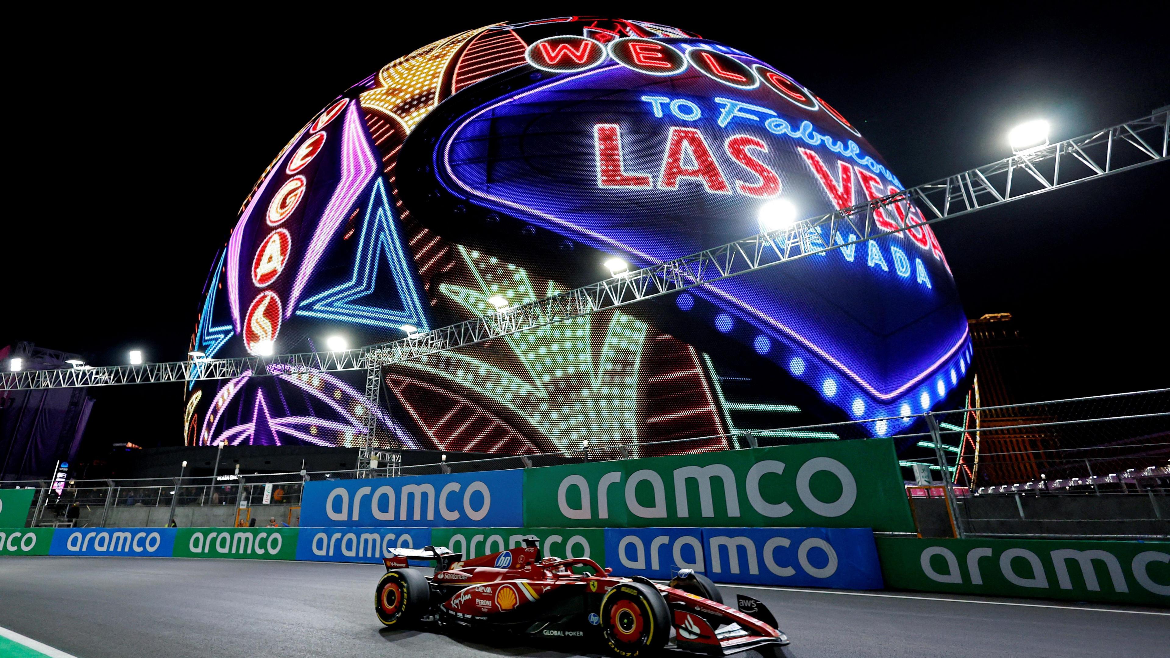 Ferrari's Charles Leclerc passes the illuminated Sphere which displays a 'Welcome to Fabulous Las Vegas' sign during first practice