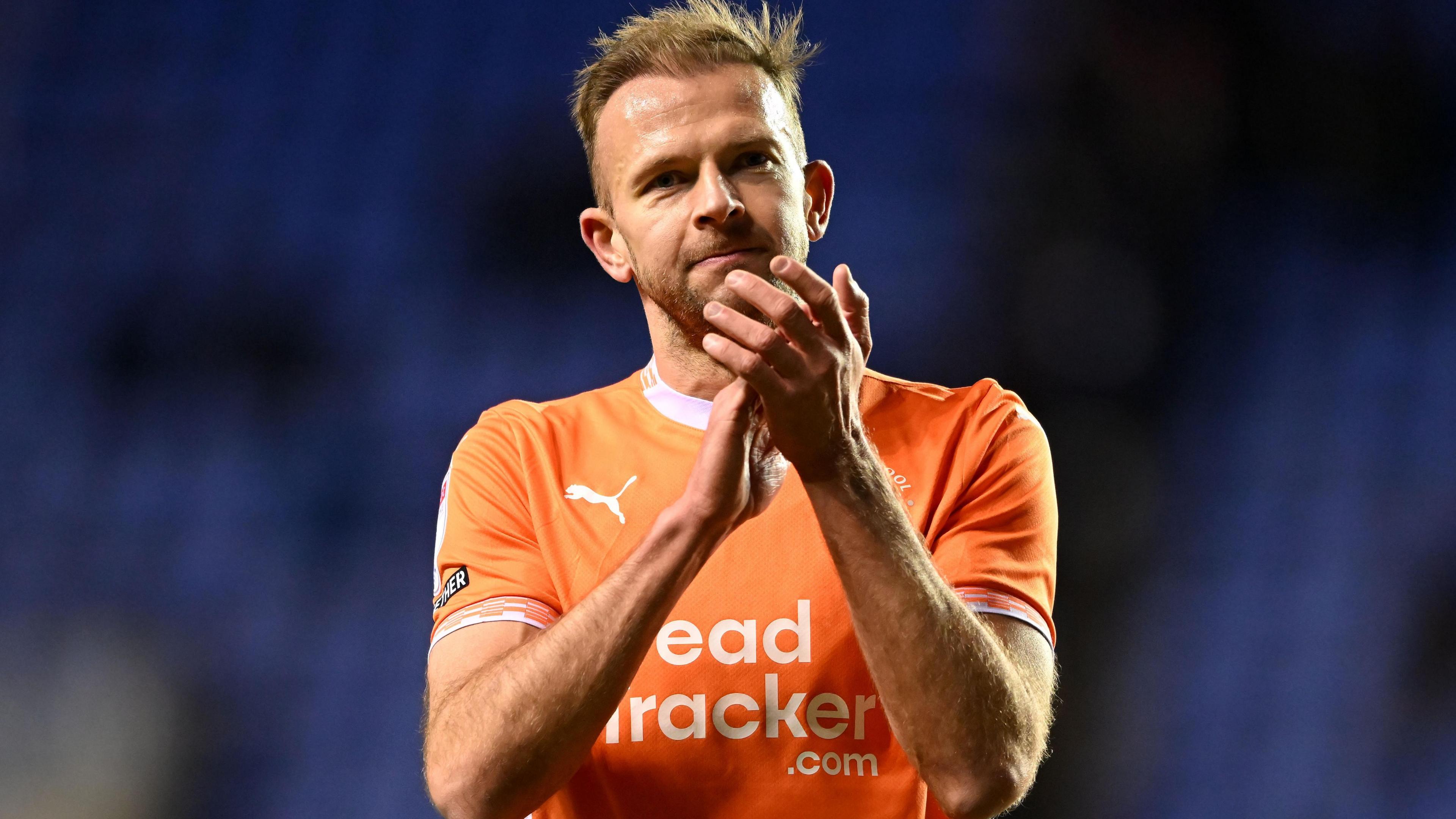 Jordan Rhodes applauds after a game for Blackpool