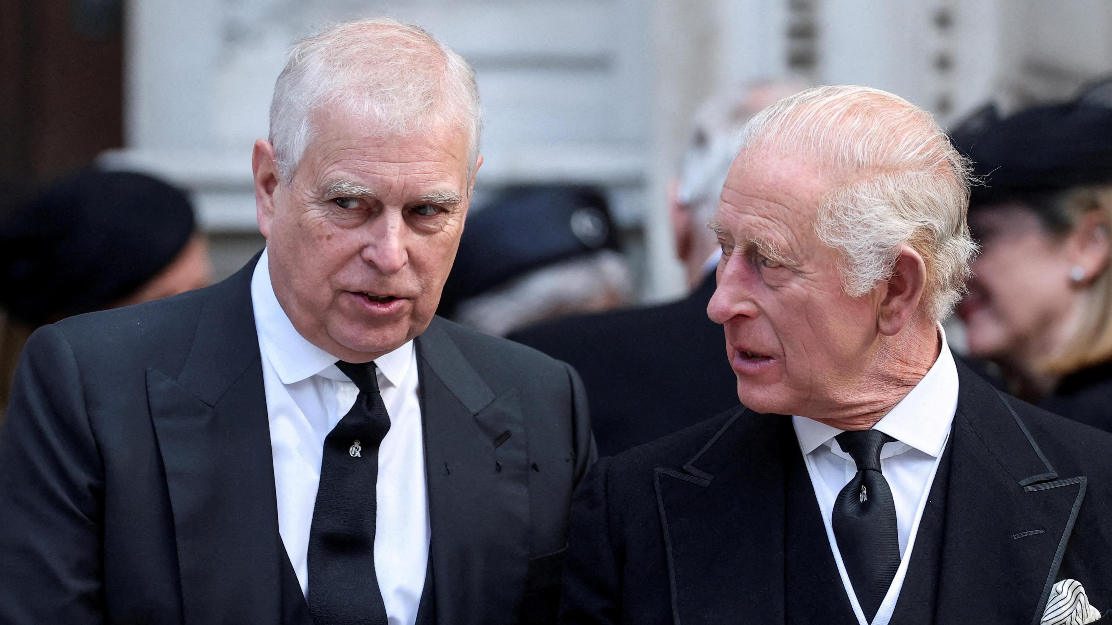 Andrew Mountbatten Windsor speaks with King Charles as they leave Westminster Cathedral on the day of the funeral of the Duchess of Kent, in September 2025.