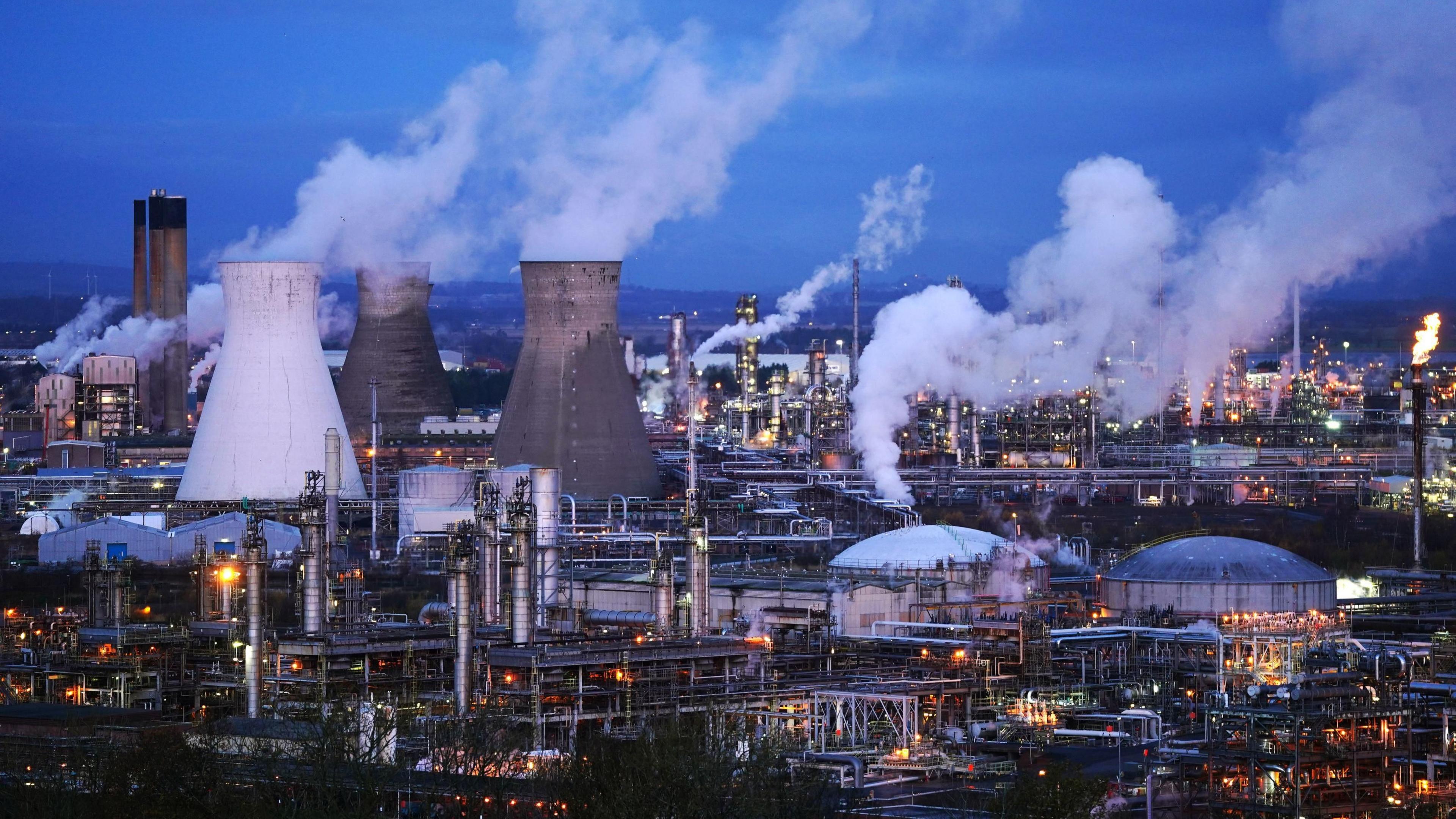 The chimneys and pipes at the Grangemouth plant illuminated by lights