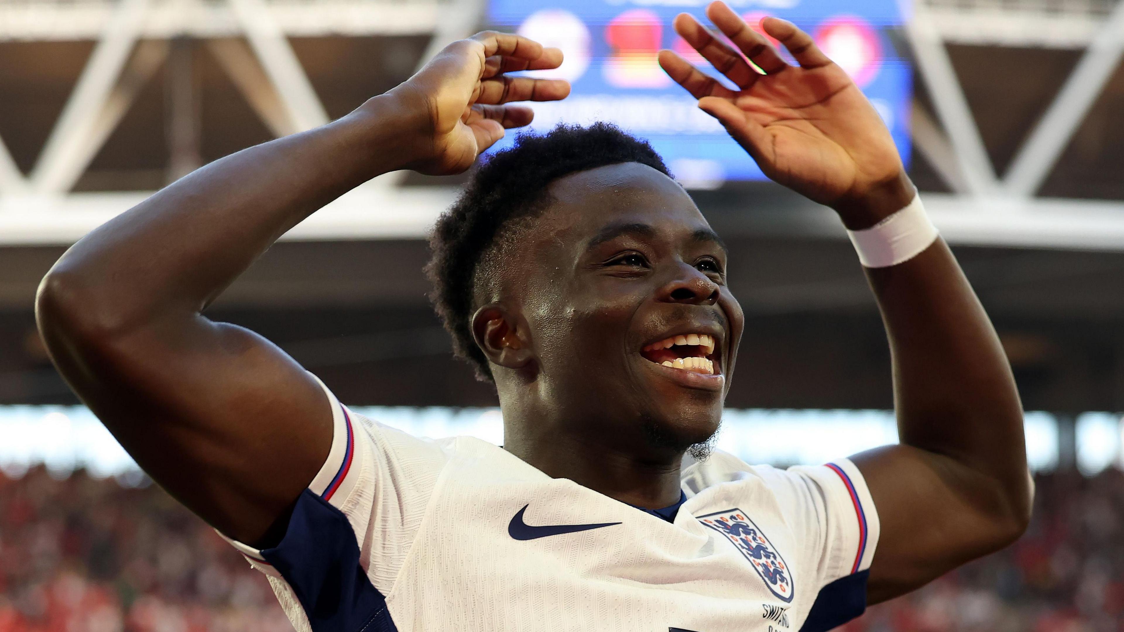 Bukayo Saka celebrates scoring penalty for England