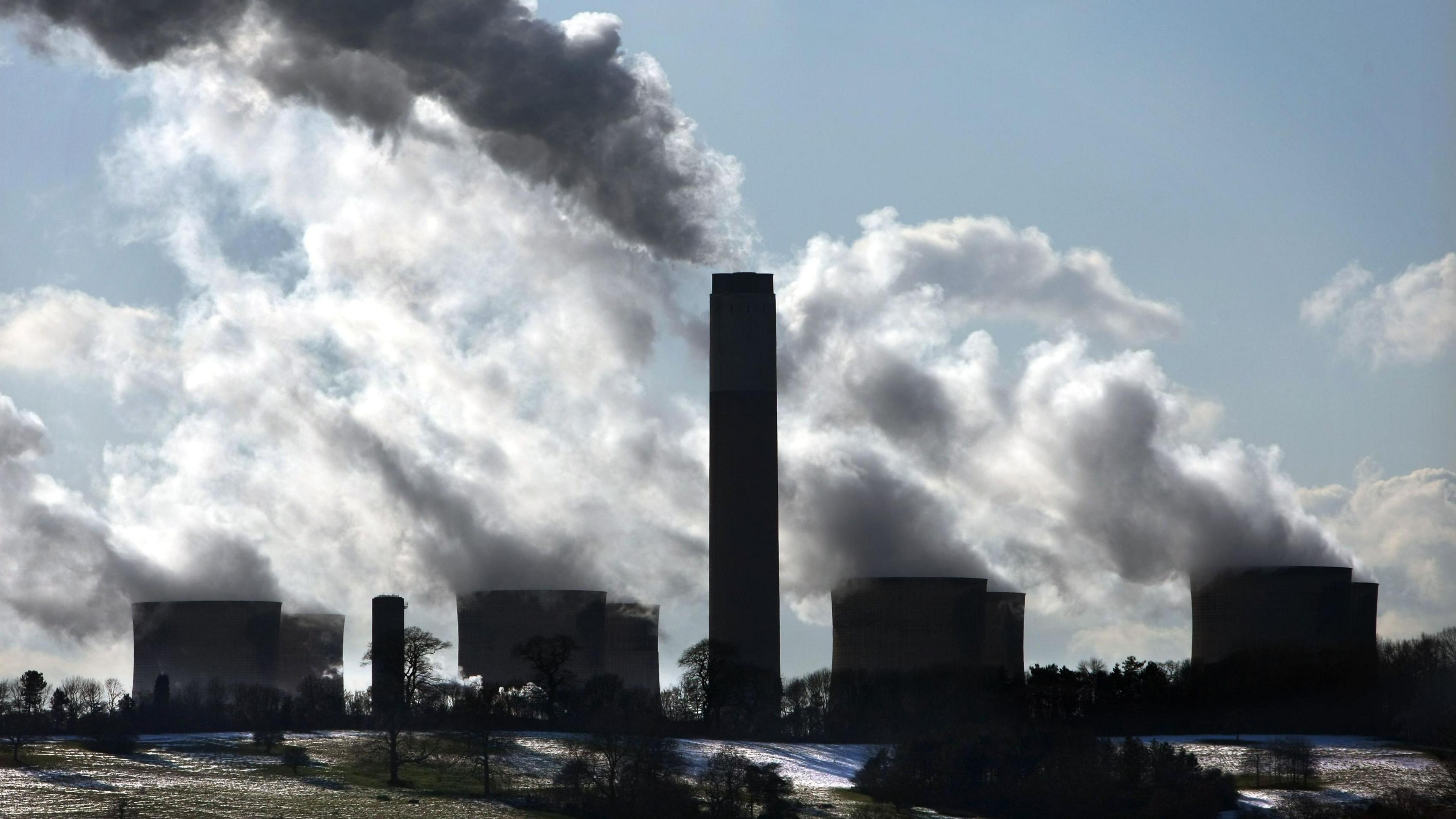 Smoke and steam rising from the chimney and cooling towers at Ratcliffe-on-Soar, Nottinghamshire