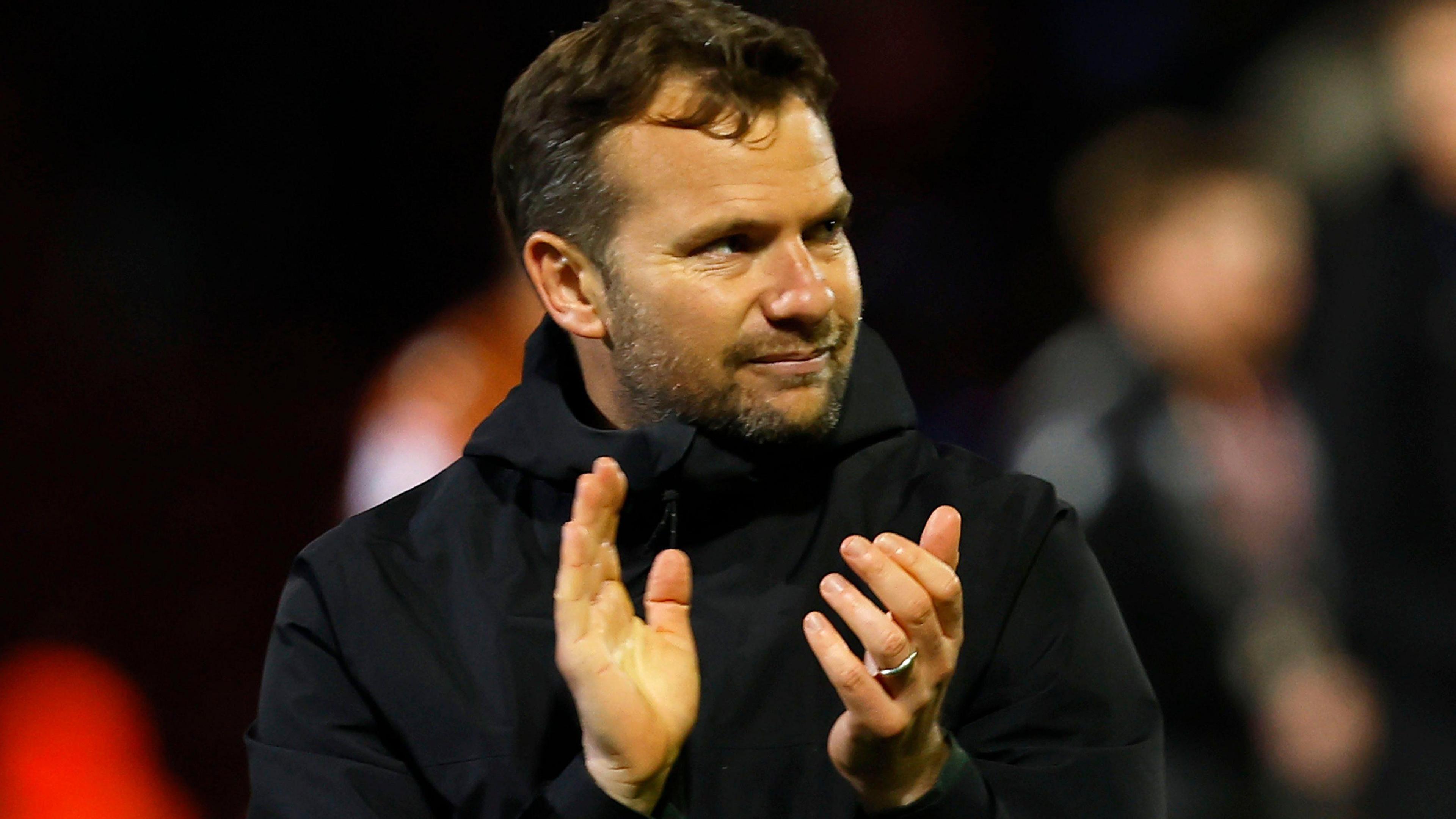 Tom Cleverley claps at the end of a game