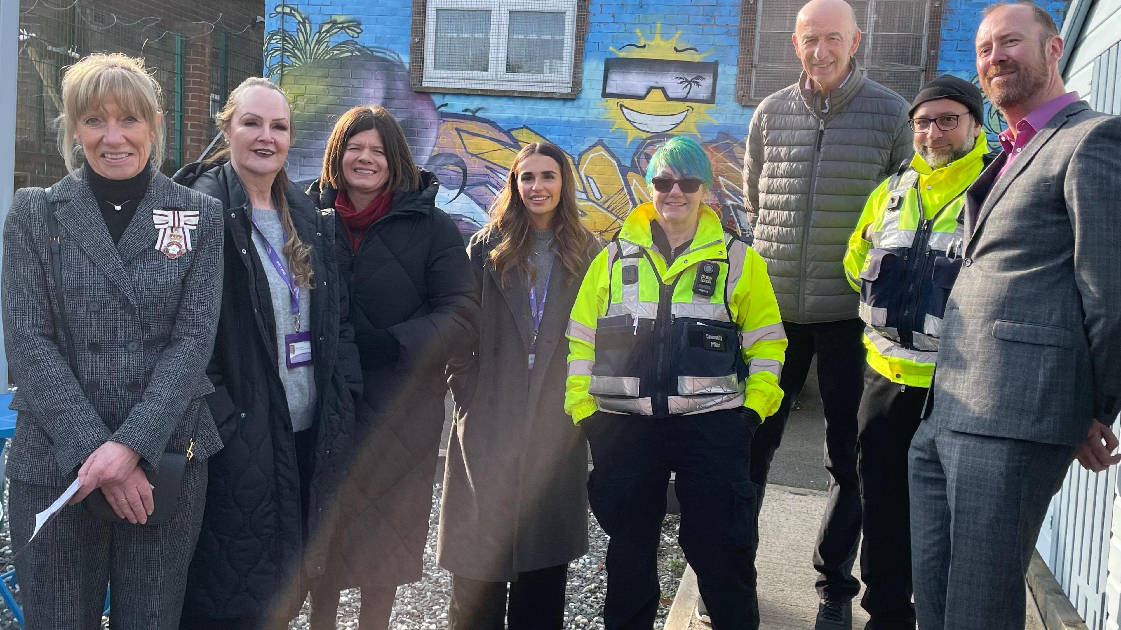 Dame Hilary Chapman (left) stands alongside volunteers, community officers and representatives from the council at The Link in Stradbroke.