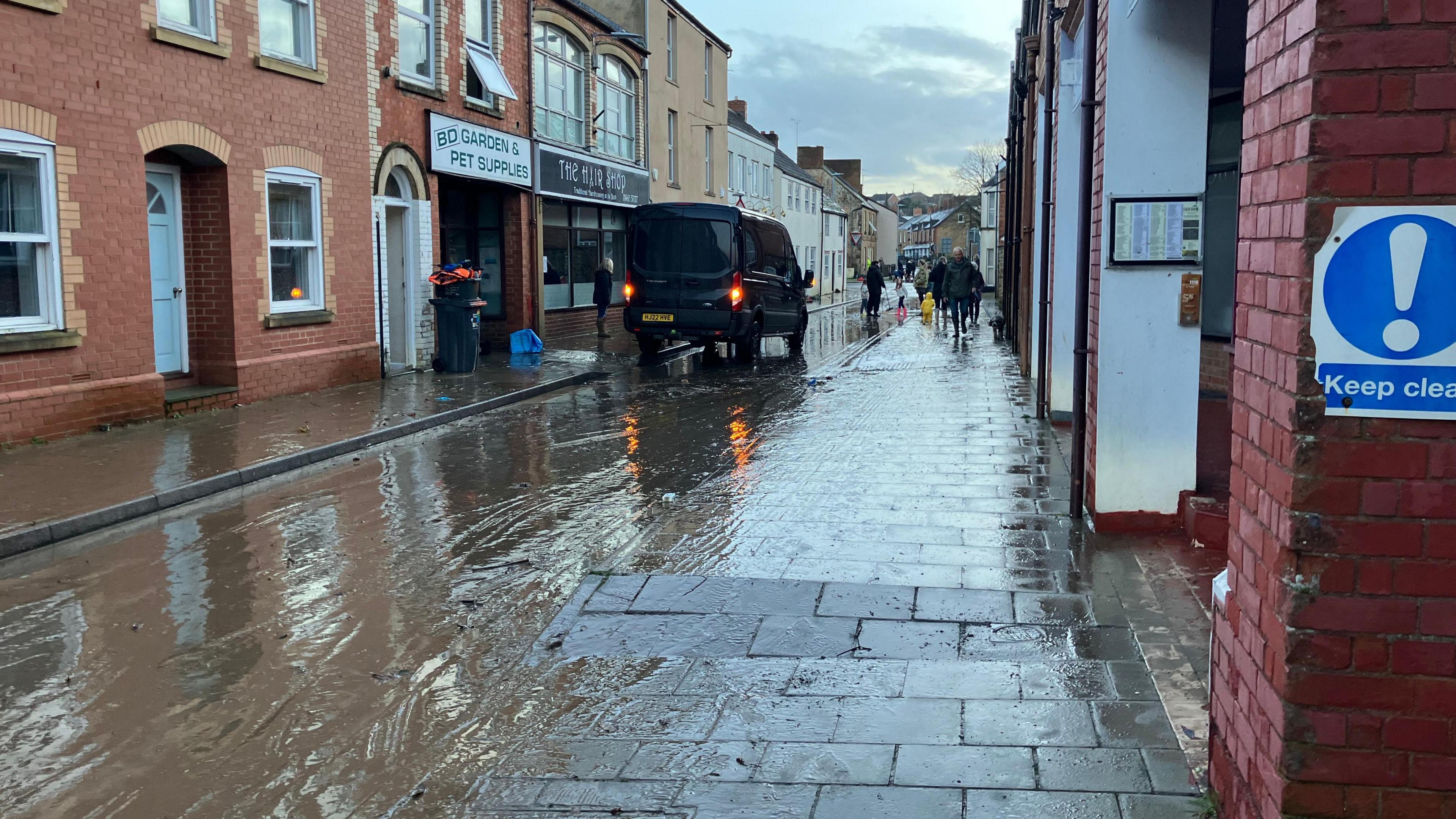 Mud covered street in the town of Ilminster. The floodwater has mostly, but not totally, receded.