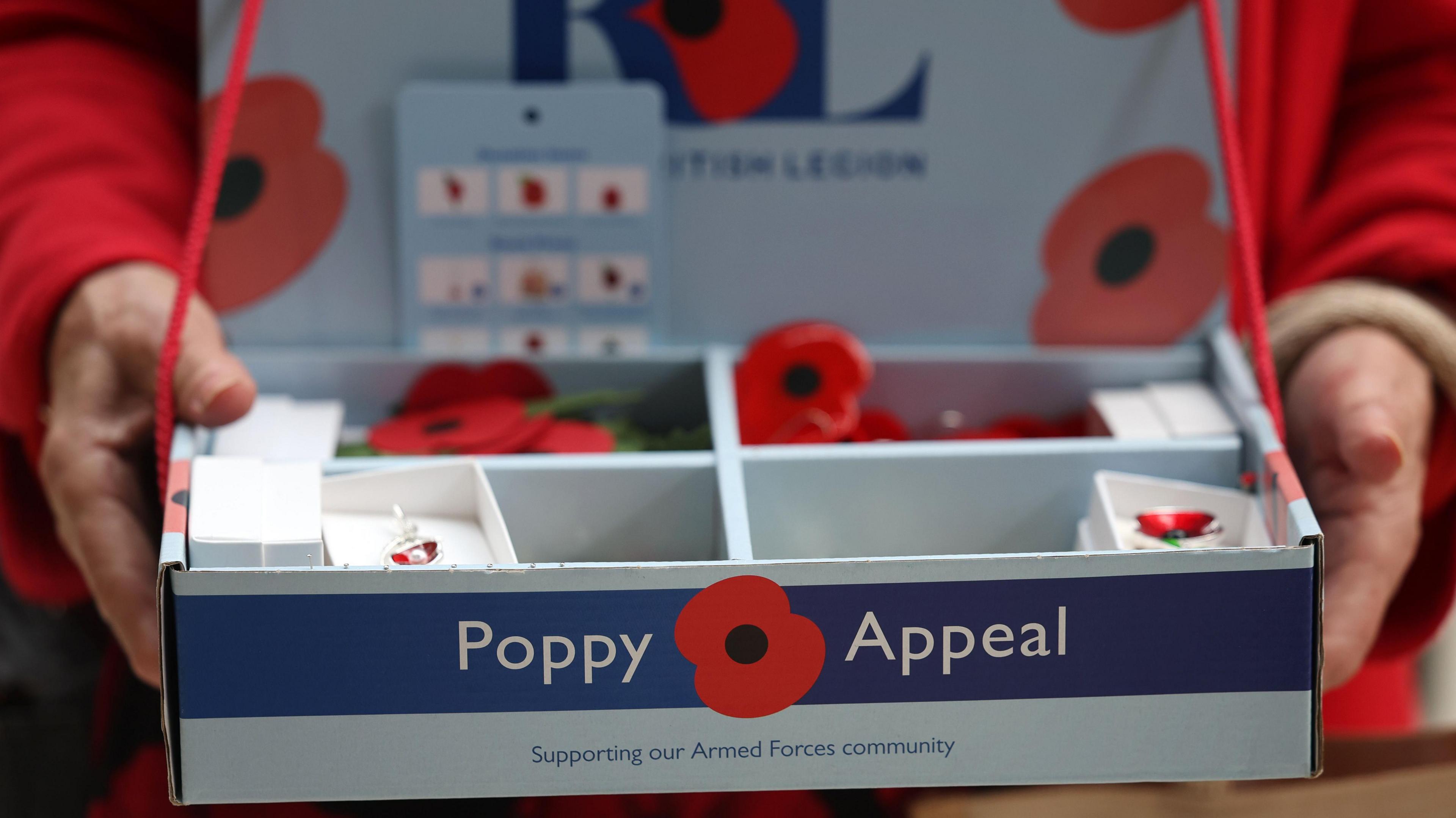 A Royal British Legion poppy appeal container