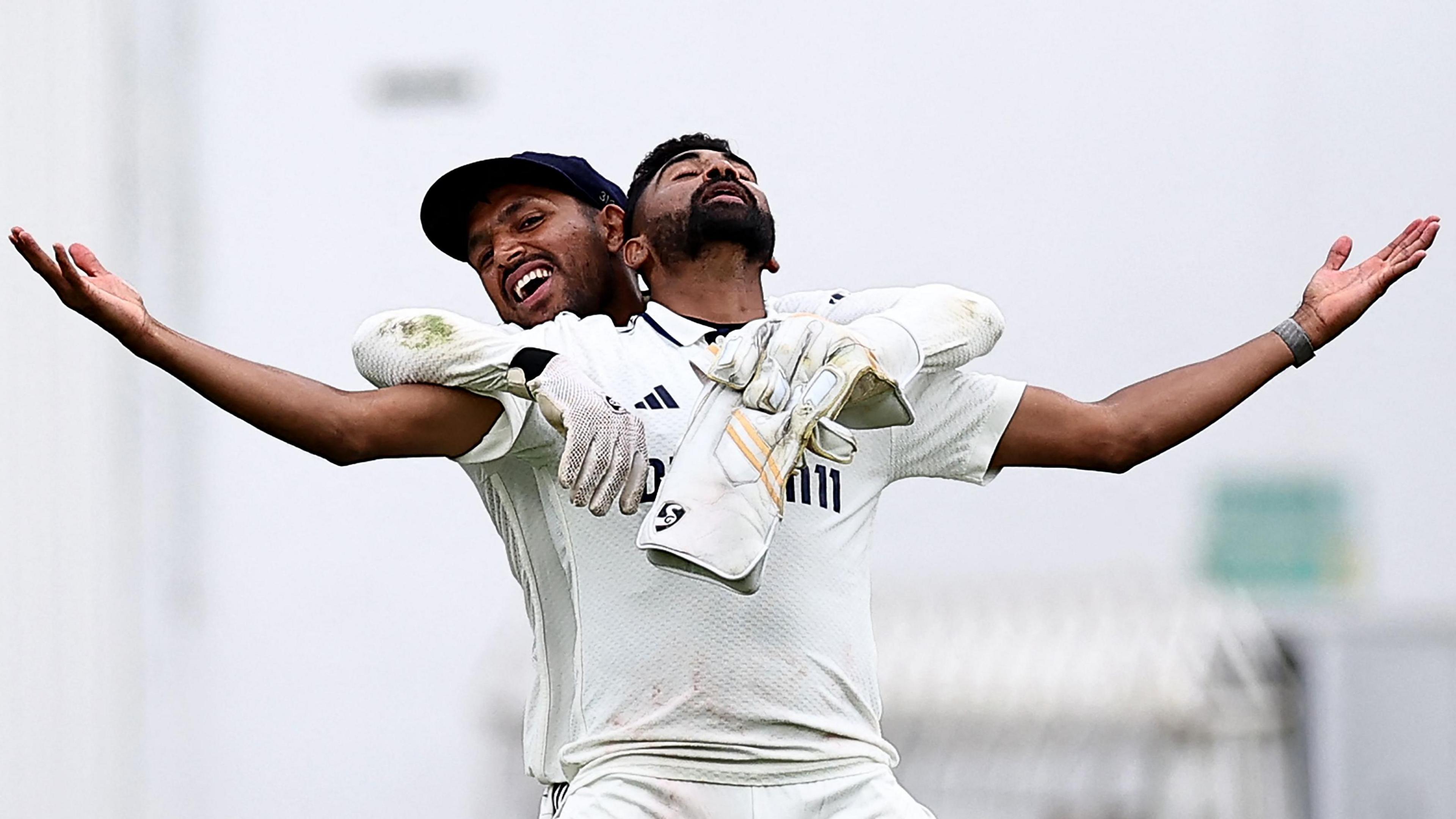 Mohammed Siraj stands with arms spread wide in celebration after taking the final wicket in the fifth Test against England
