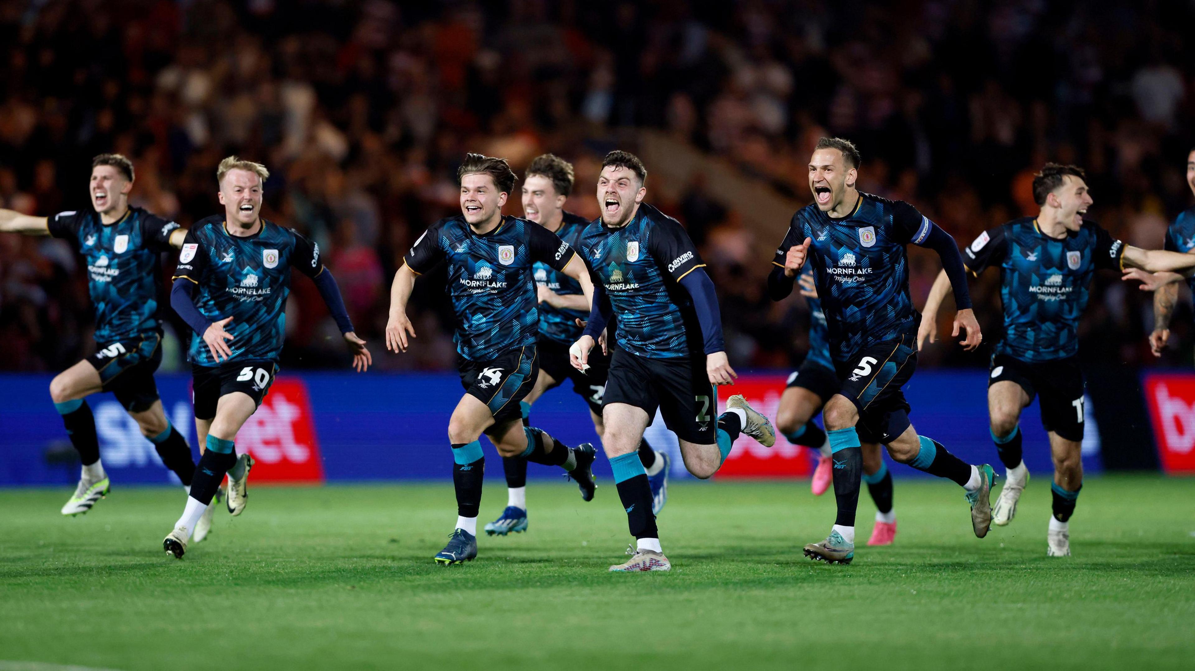 Crewe celebrate winning on penalties