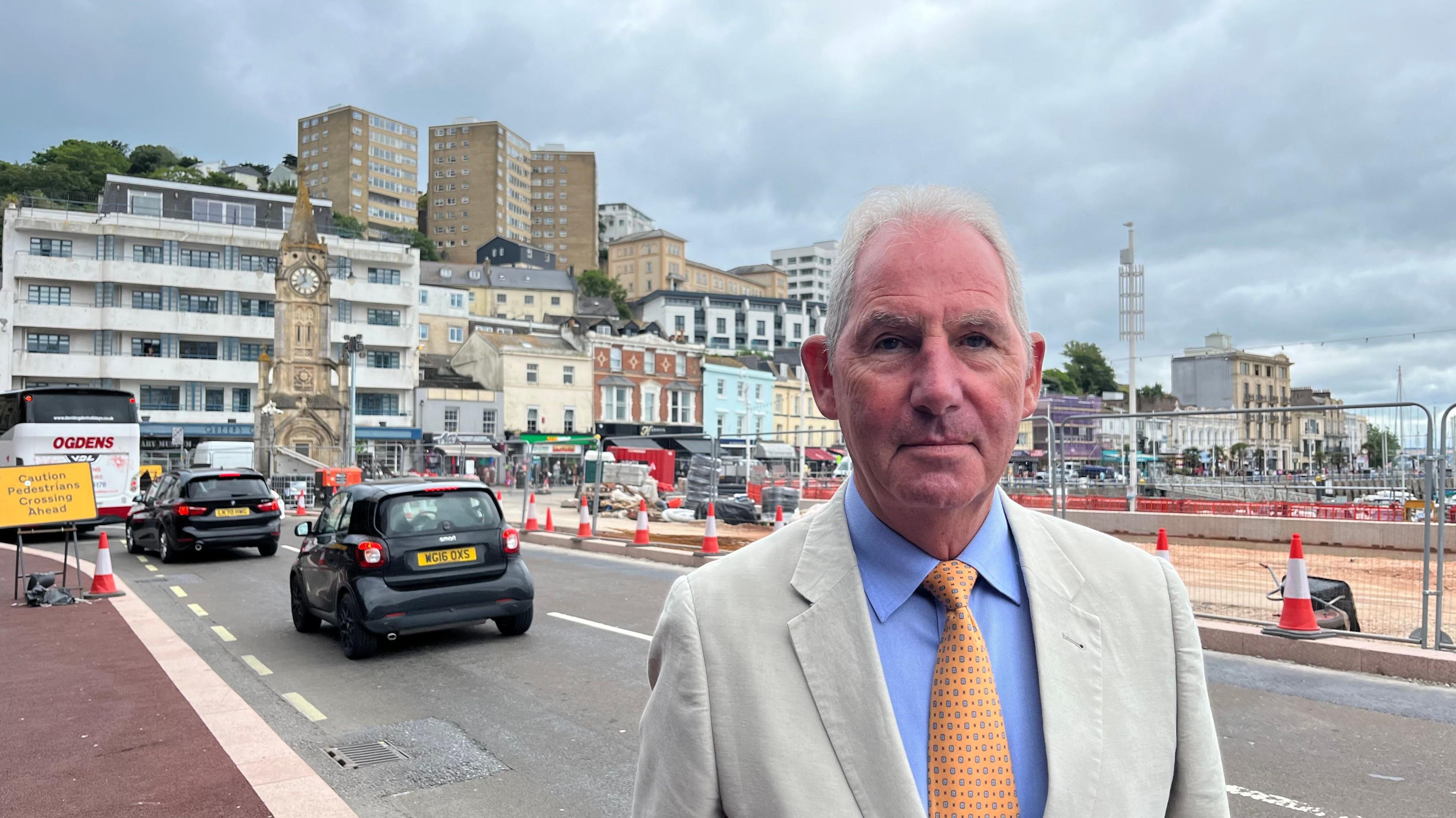 Chris Lewis standing in front of the regeneration scheme in Torquay