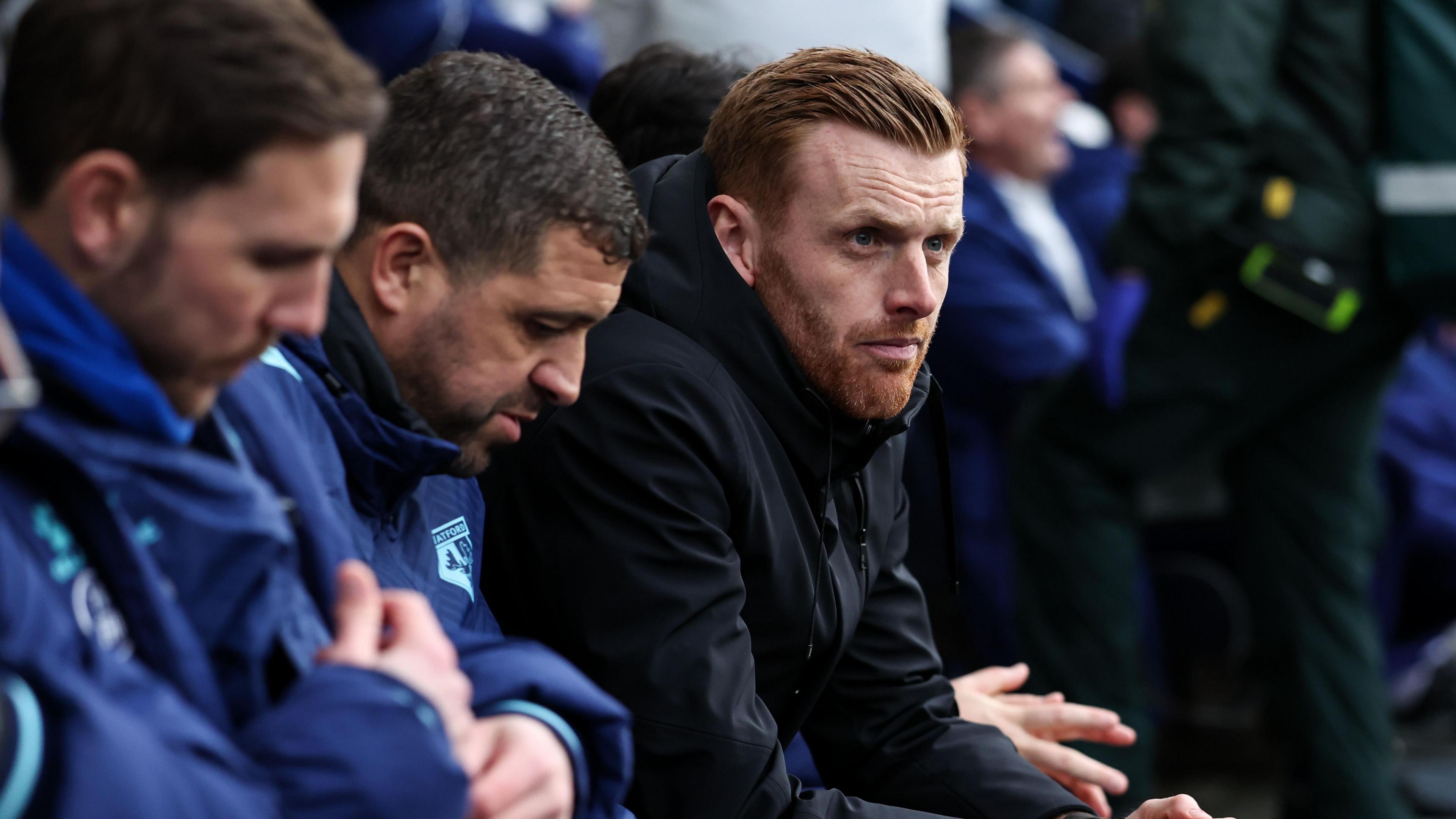 New Watford head coach Ed Still looks on from the dugout at Preston