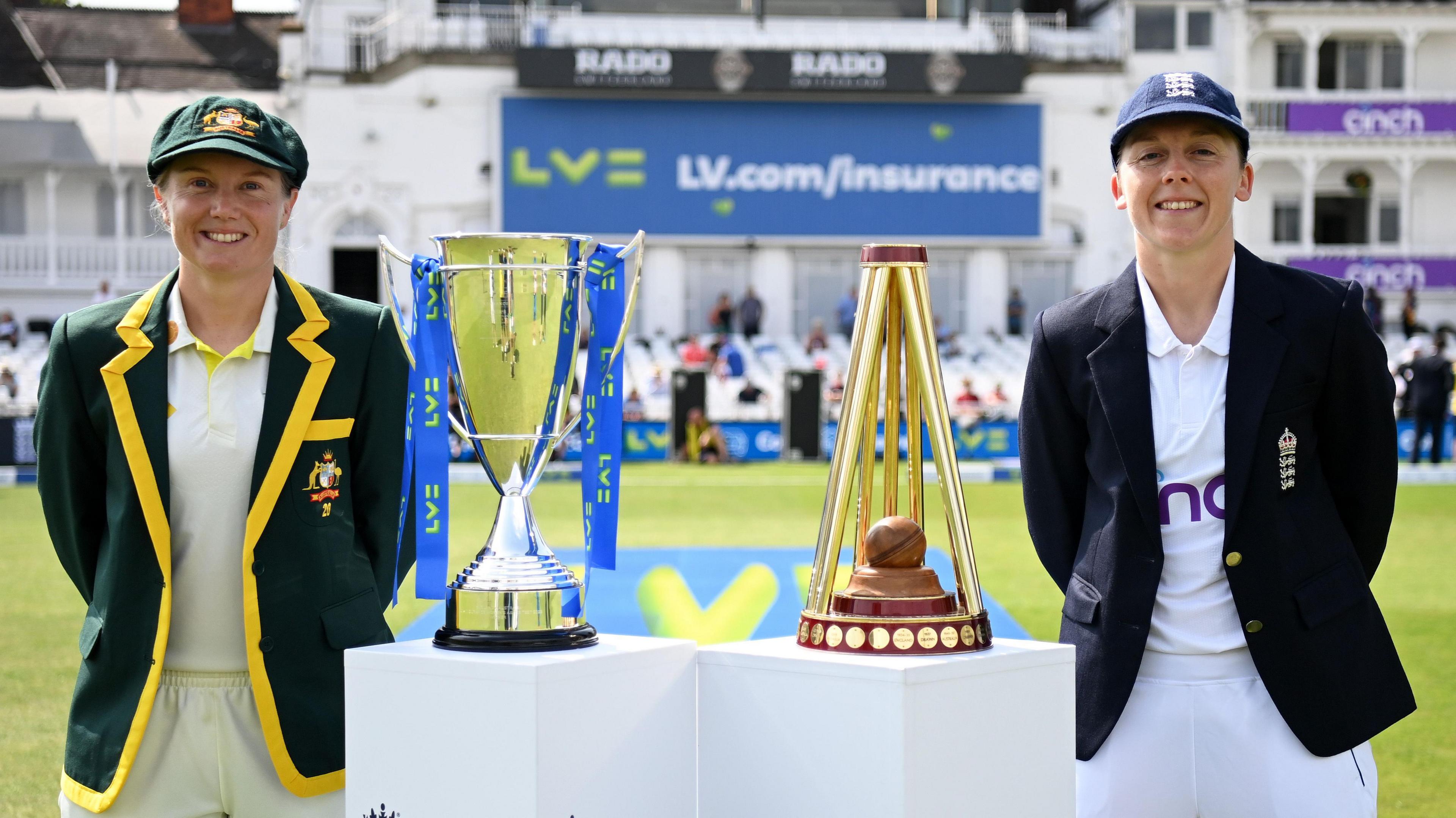 Alyssa Healy of Australia and Heather Knight of England with the Women's Ashes trophies