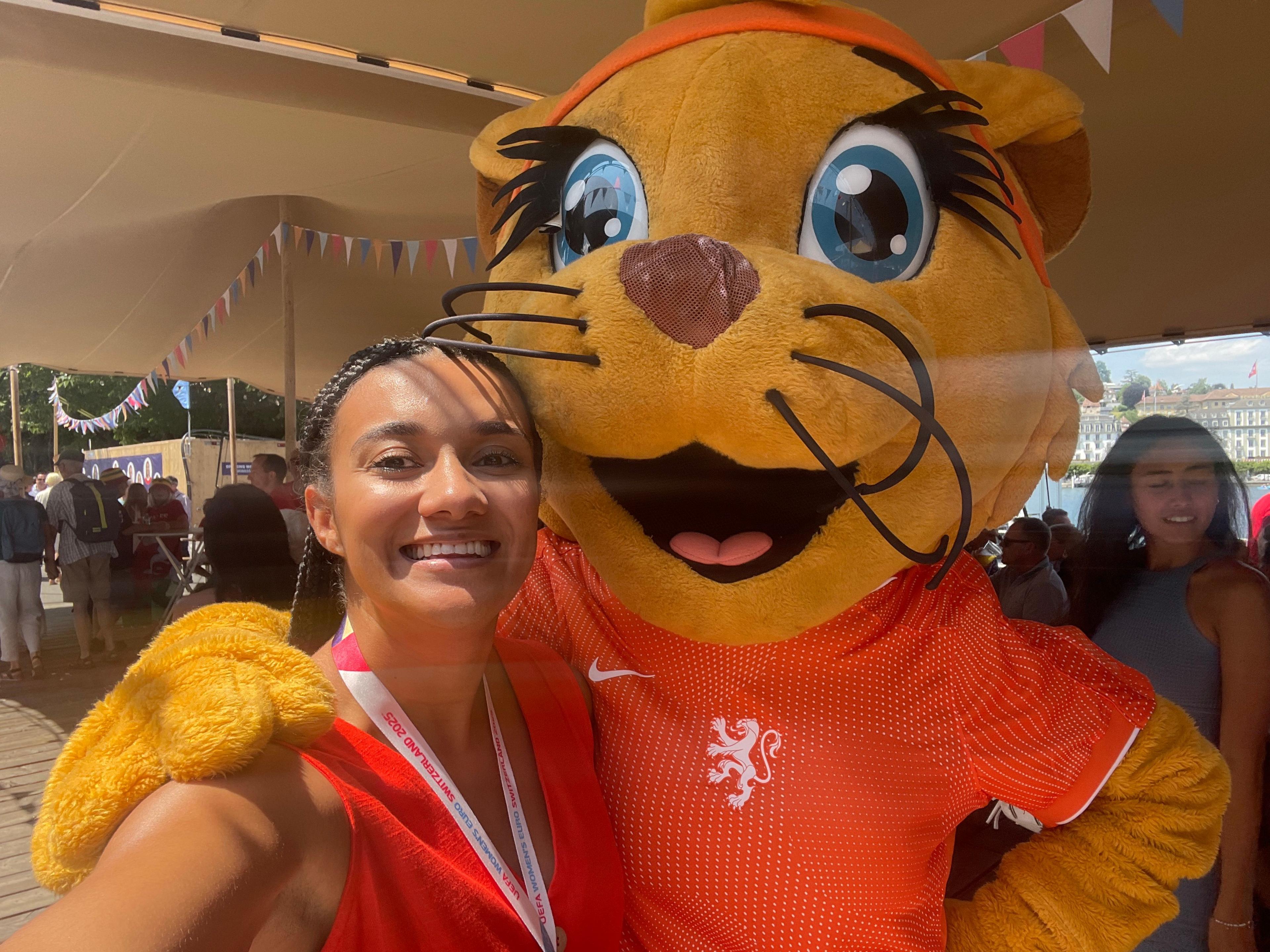 Nina Blissett with Kicky the lion mascot for the Netherlands football team
