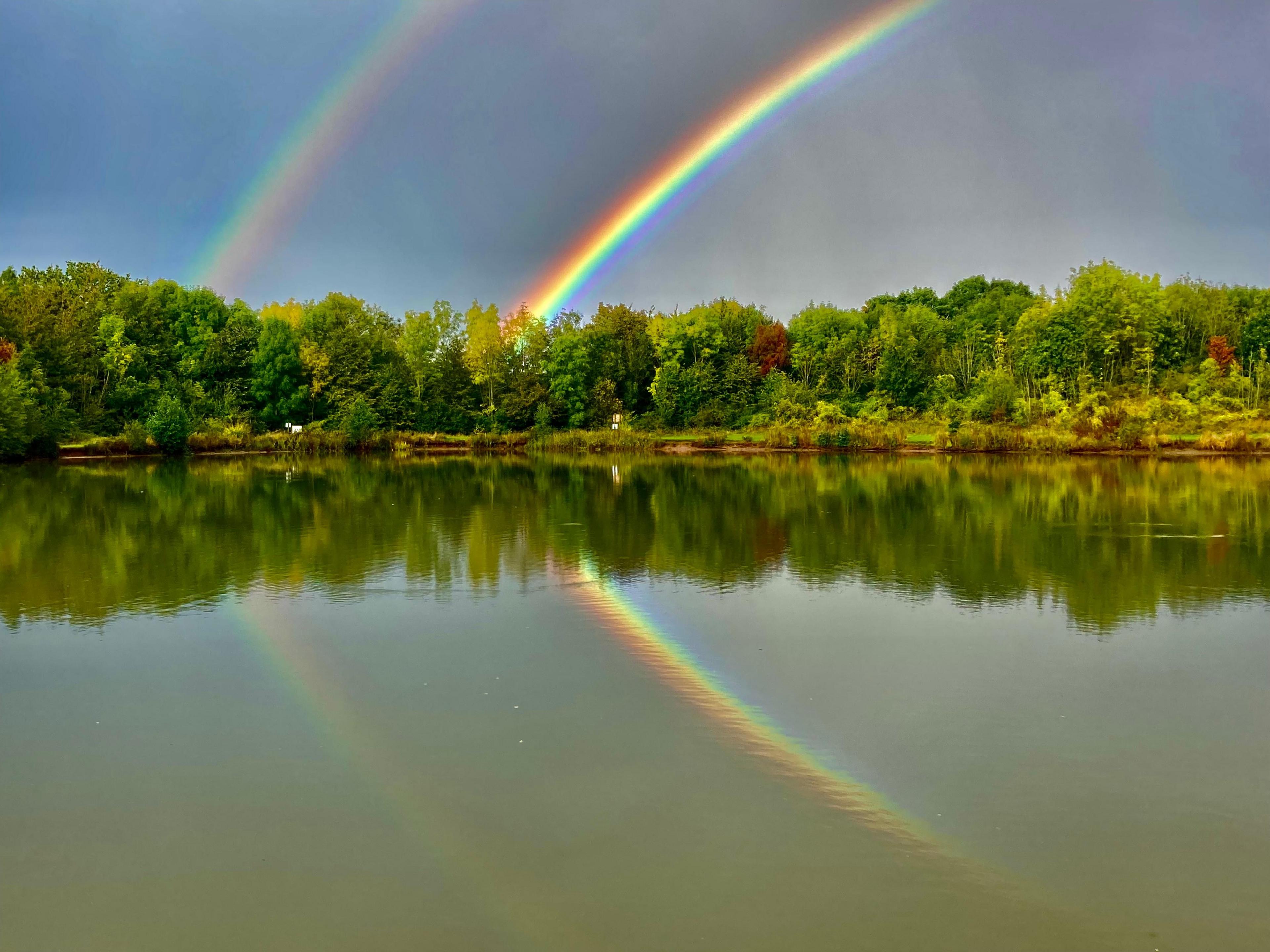 A rainbow overlooking a lake