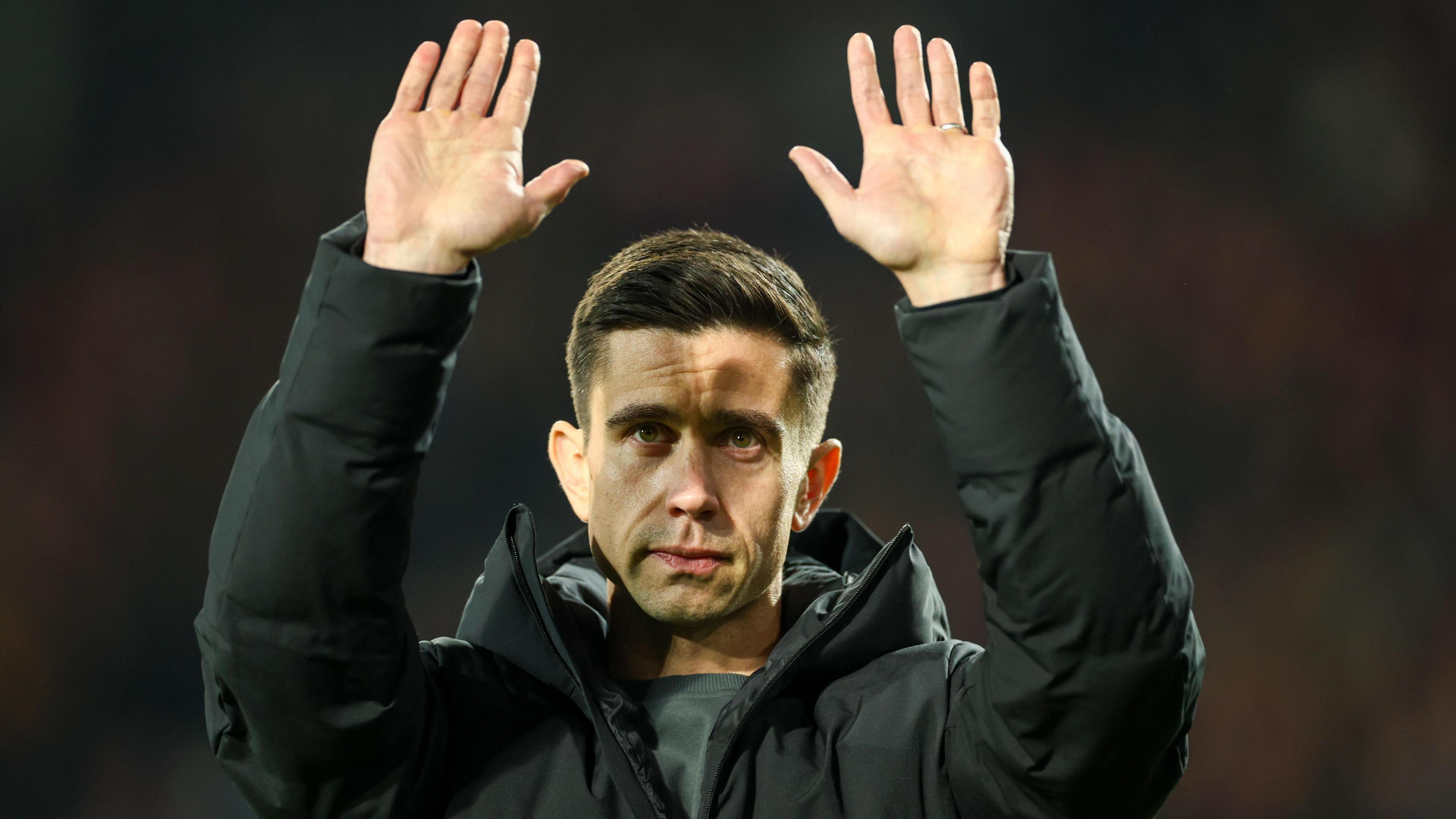 Eric Ramsay holds his hands up to West Brom fans