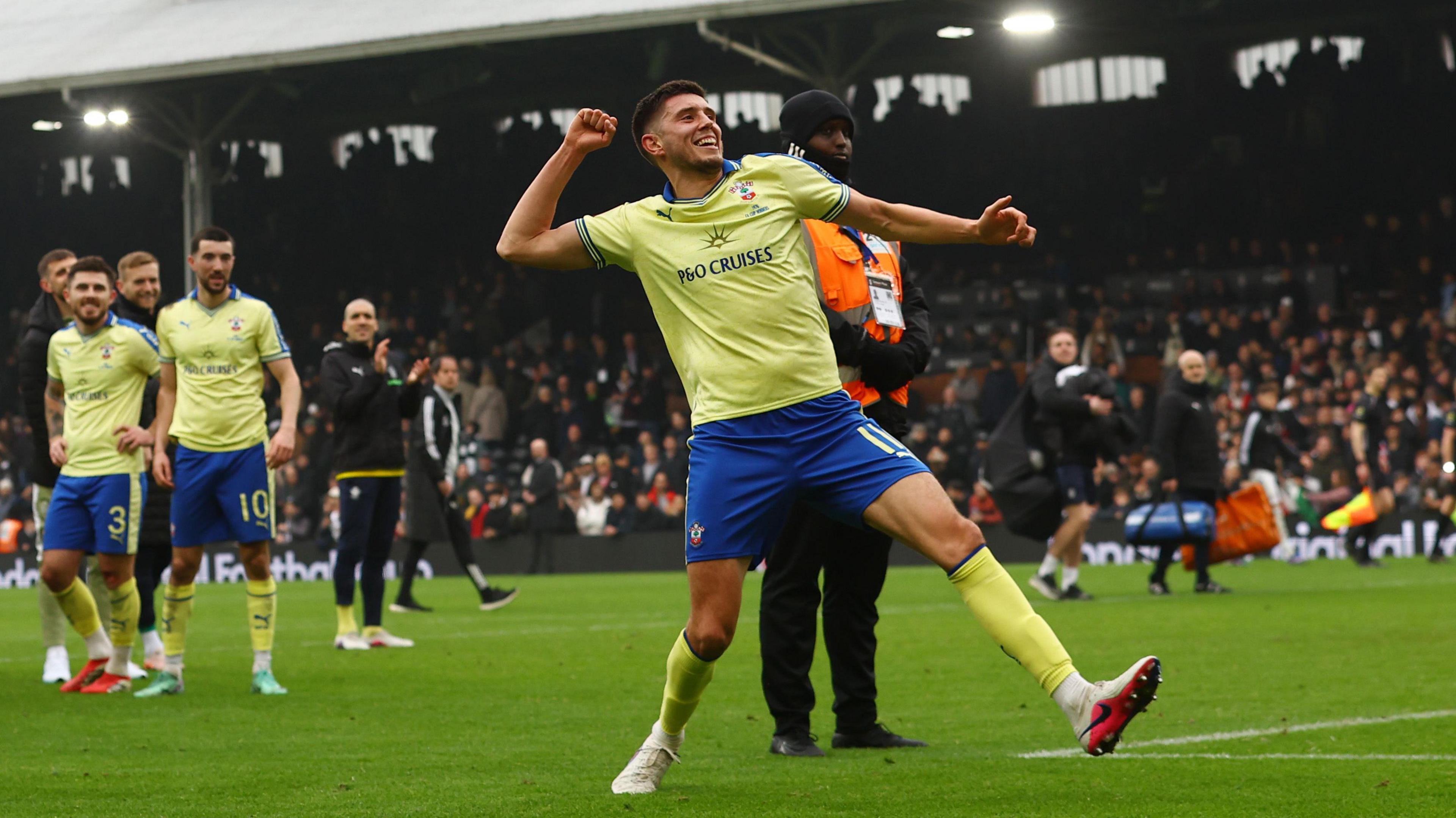 Ross Stewart celebrates with the Southampton fans after beating Fulham in the FA Cup