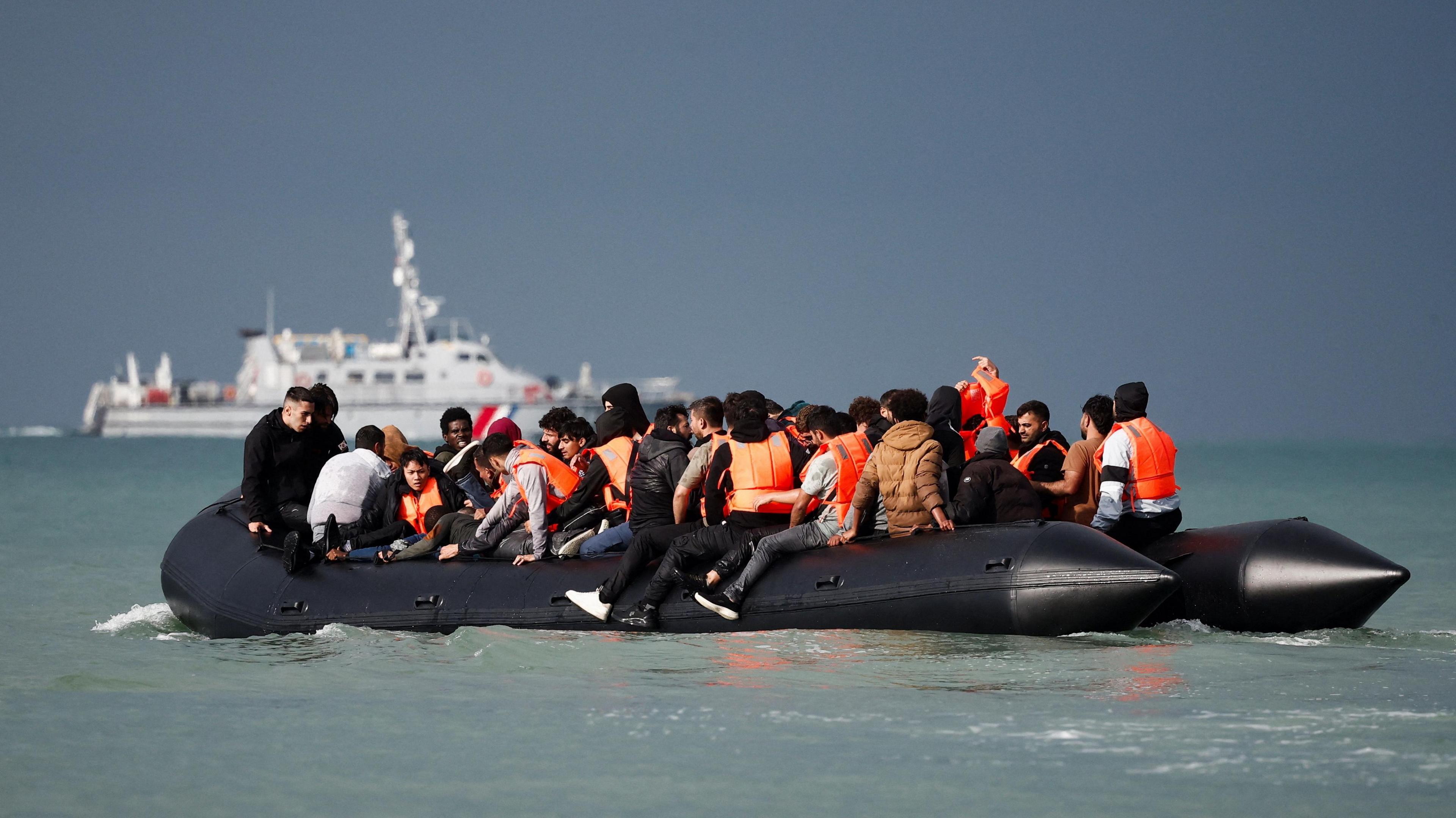 Migrants on an inflatable dinghy attempt to cross the English Channel to reach the UK from Wimereux, France, on 4 September, 2024