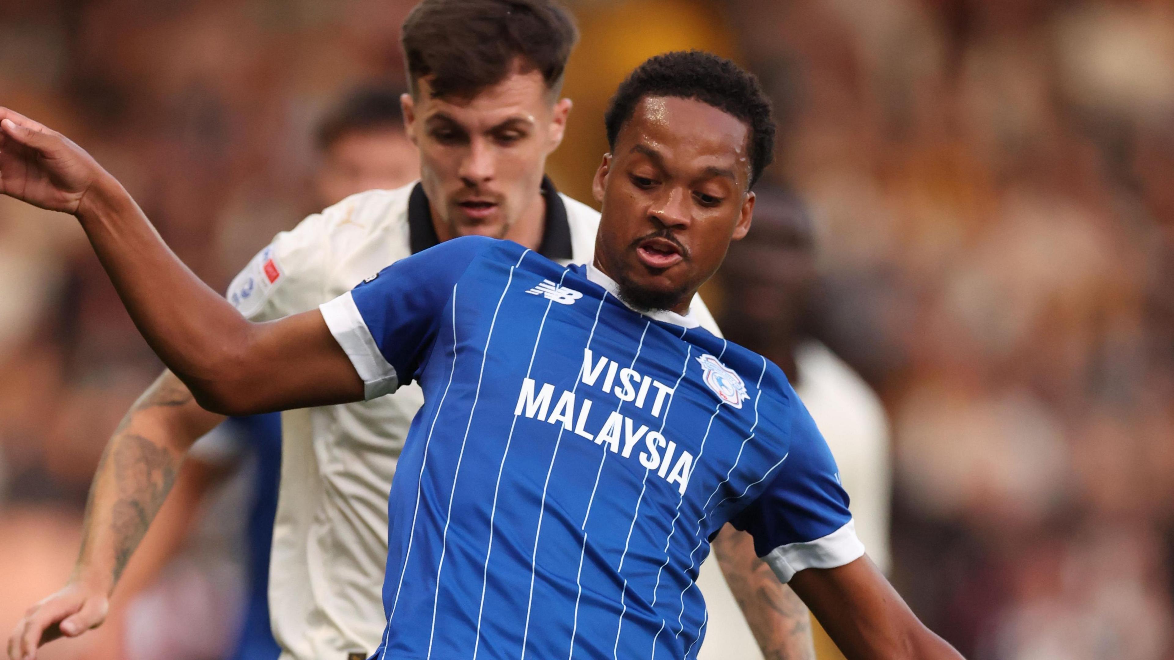 Mitchell Clark (left) of Port Vale and Chris Willock of Cardiff City