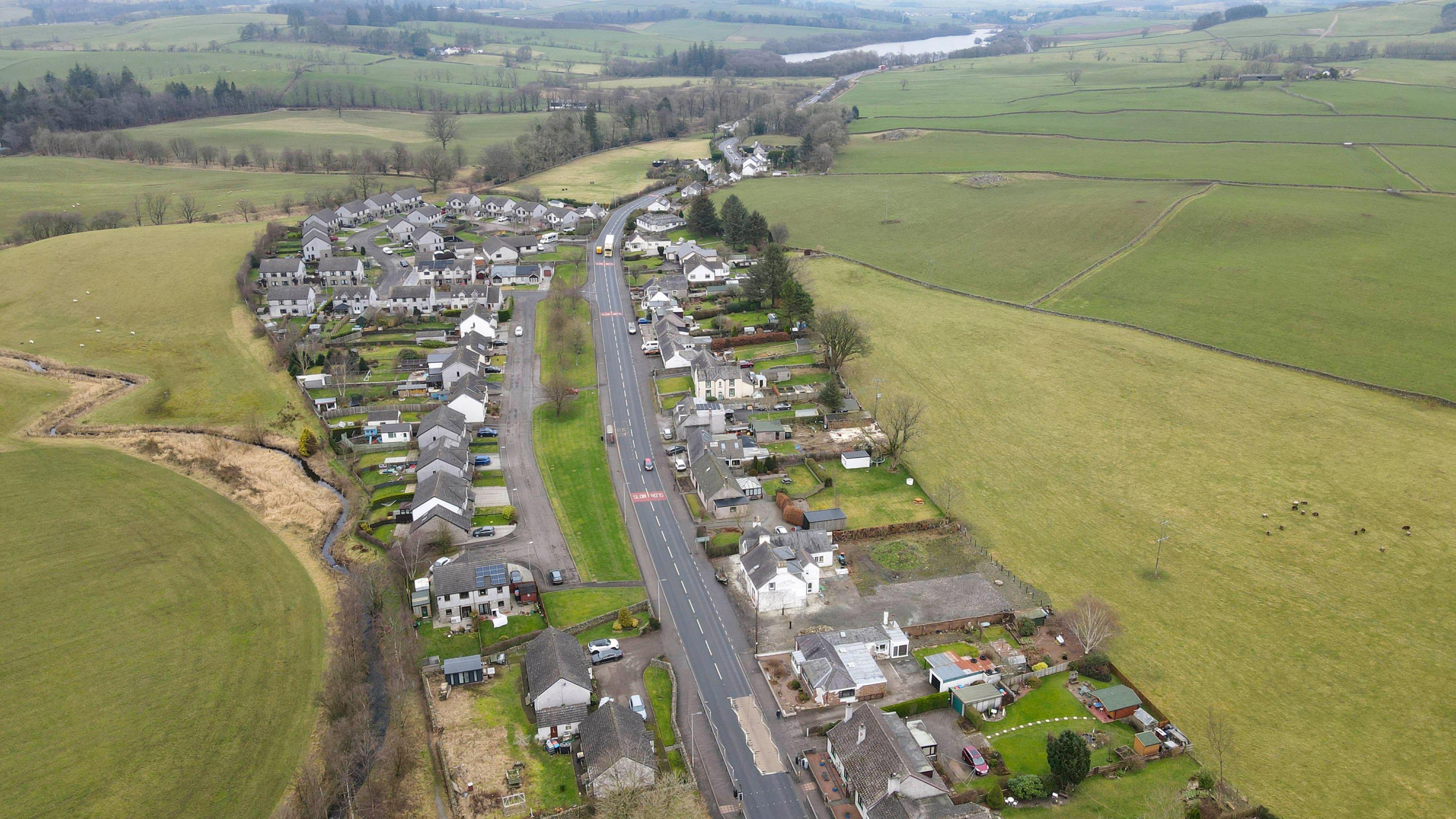 The A75 passing through the heart of the village of Springholm