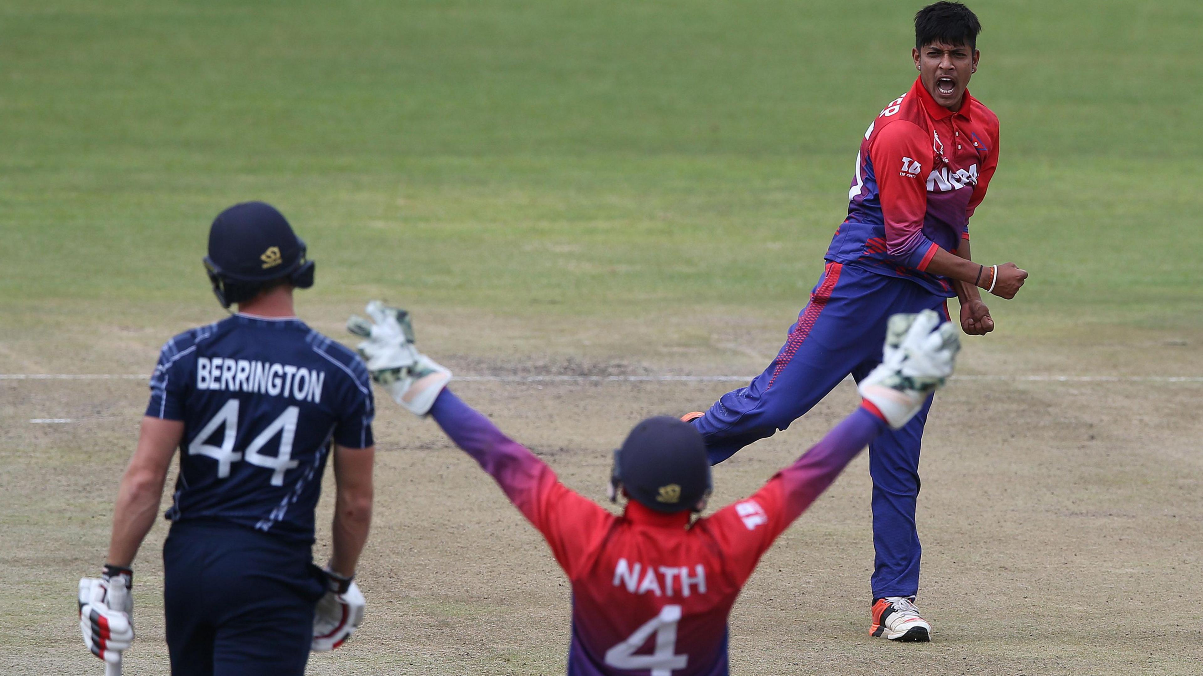 Nepal celebrate taking the wicket of Scotland's Richie Berrington in 2018