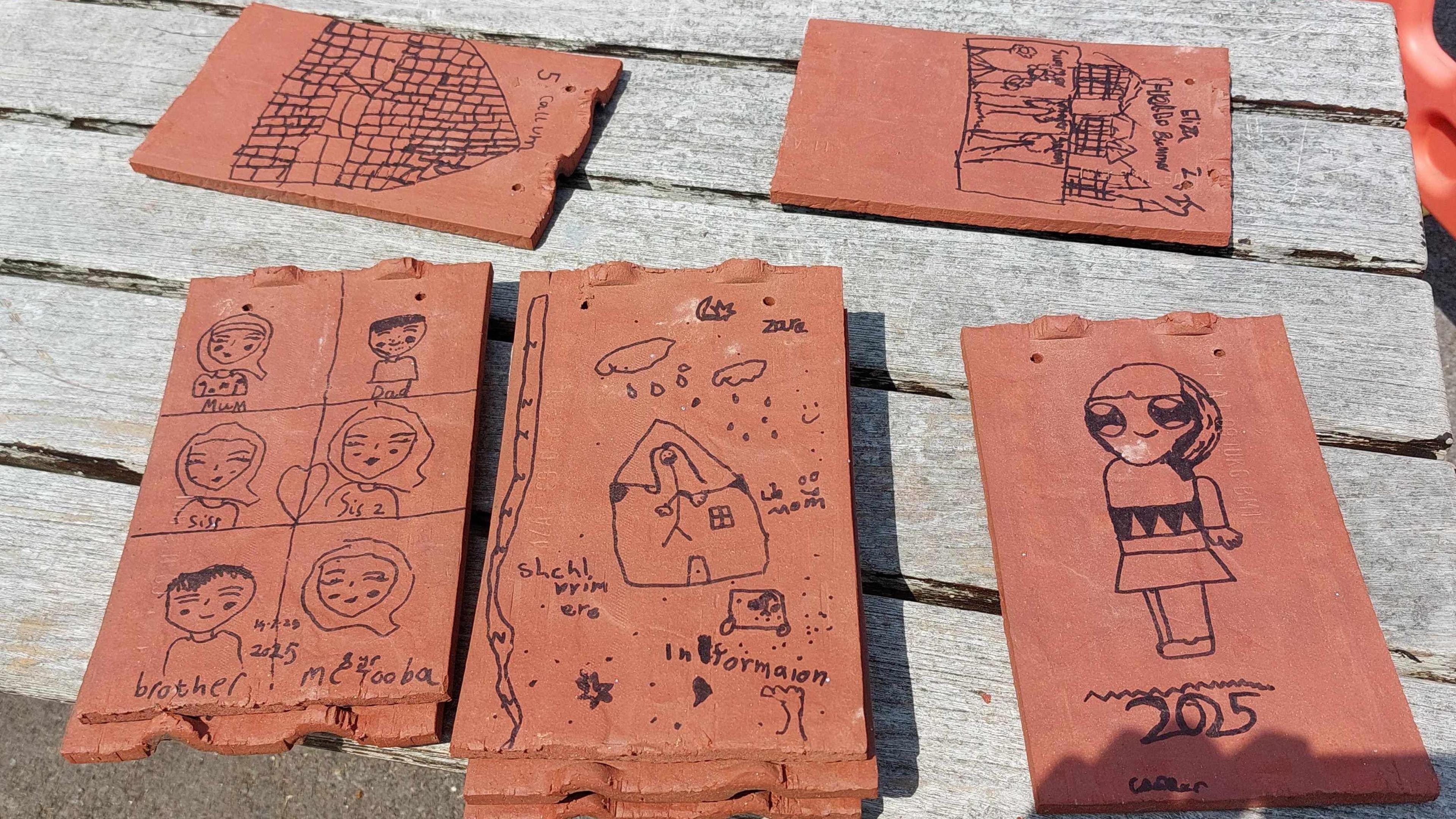 Close up of decorated tiles by school children