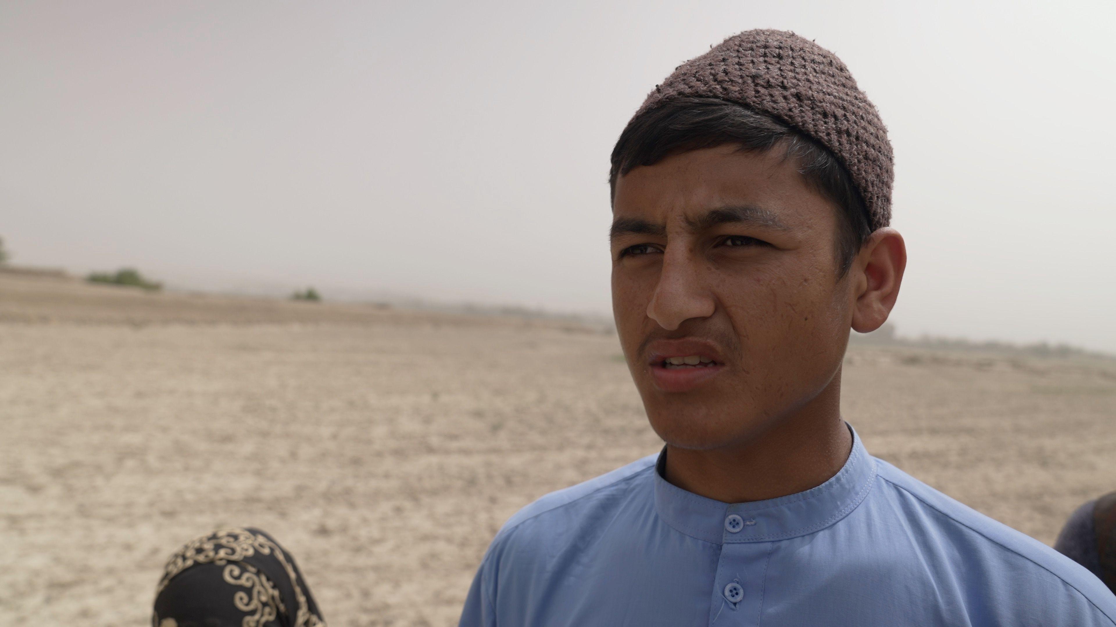 Elhamuddin wearing a brown knitted hat