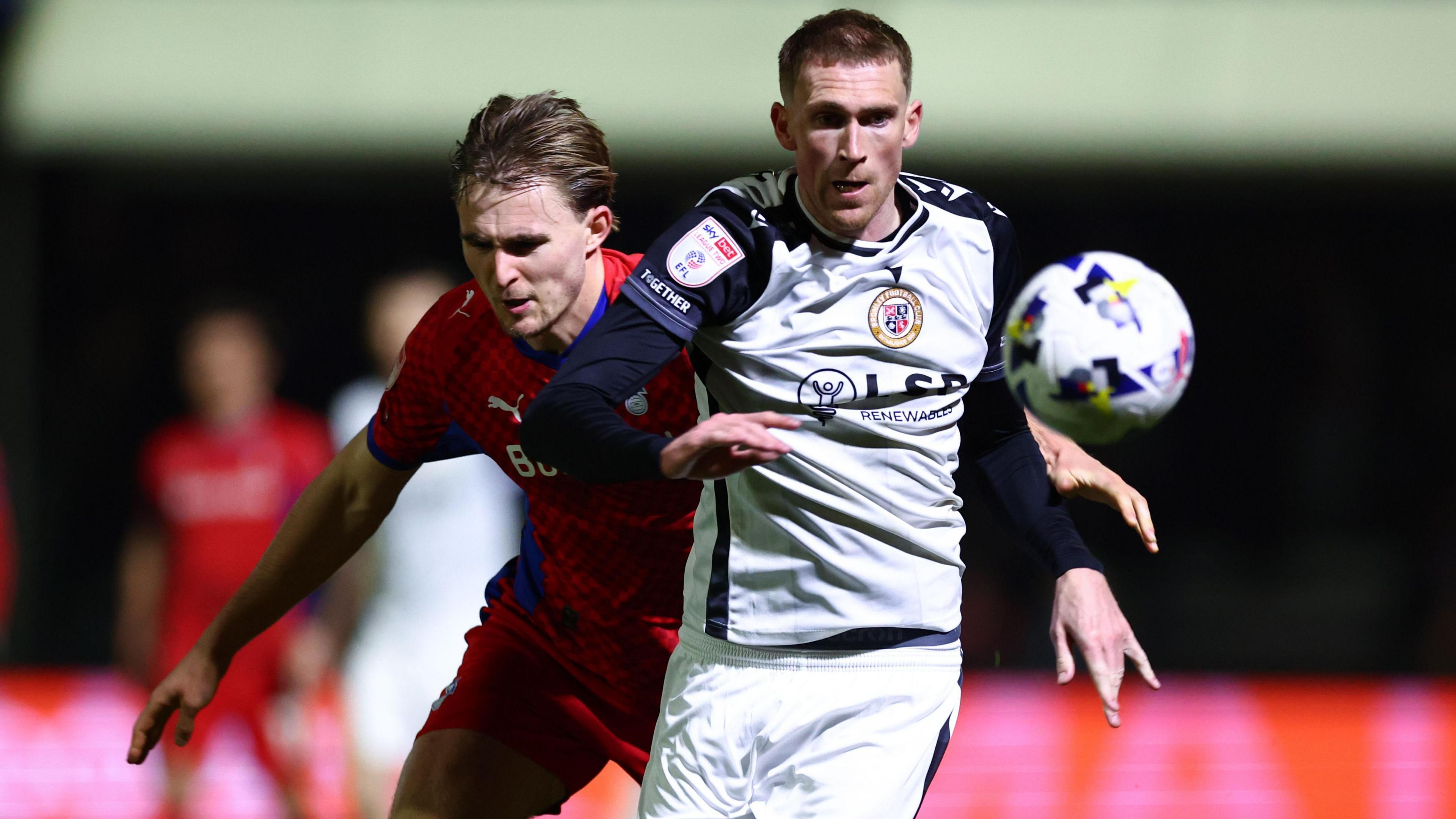Mitch Pinnock of Bromley chased by Will Sutton of Oldham Athletic