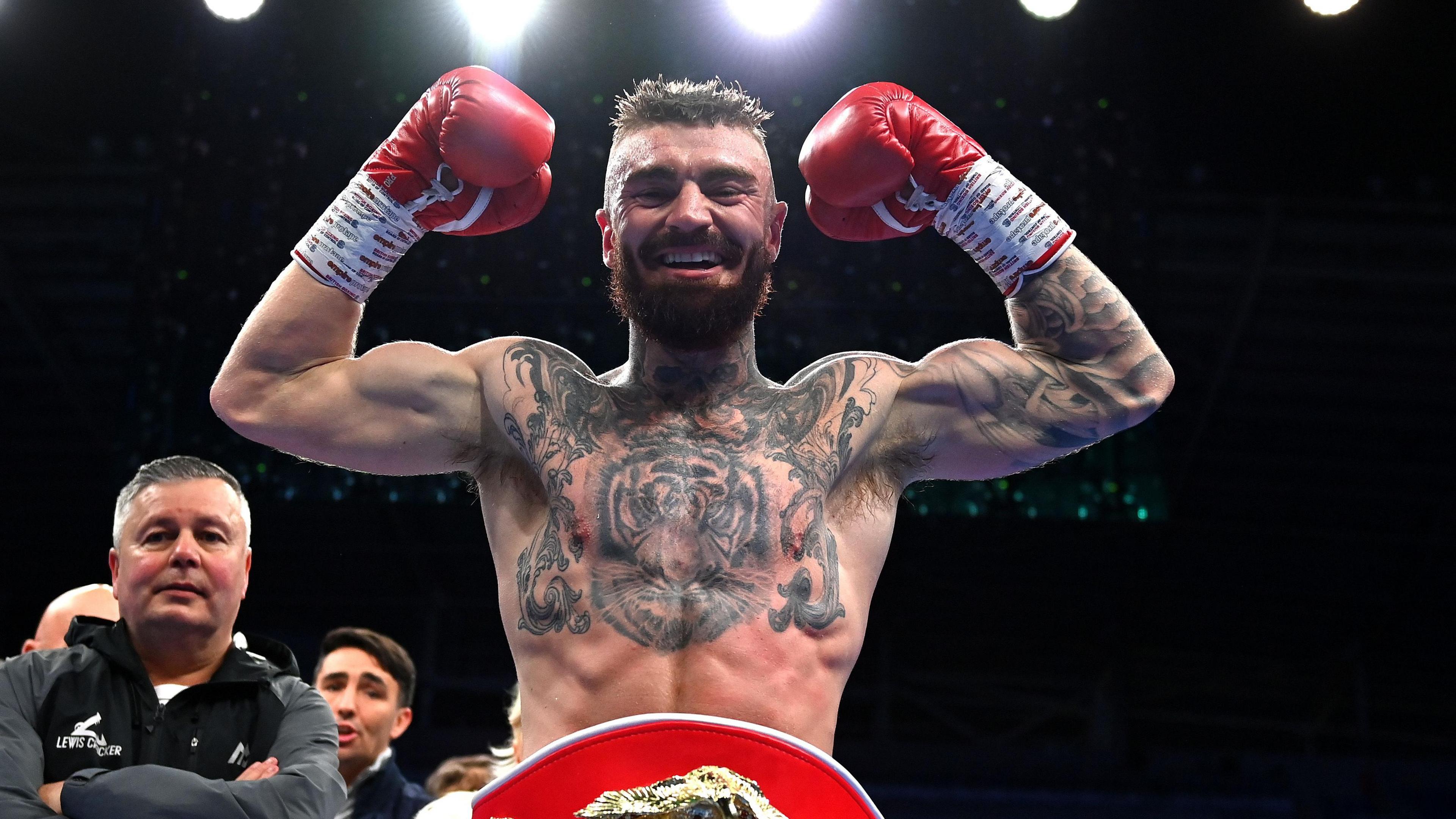 Lewis Crocker celebrates with the belt
