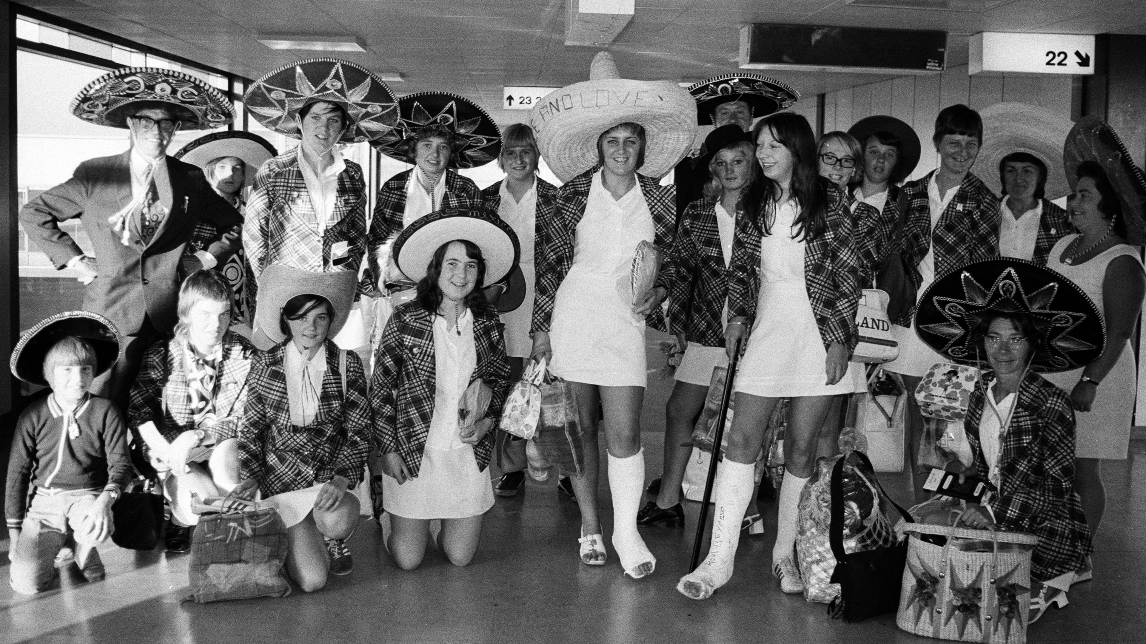 The Copa 71 British Independents team pose in sombreros in a Heathrow terminal