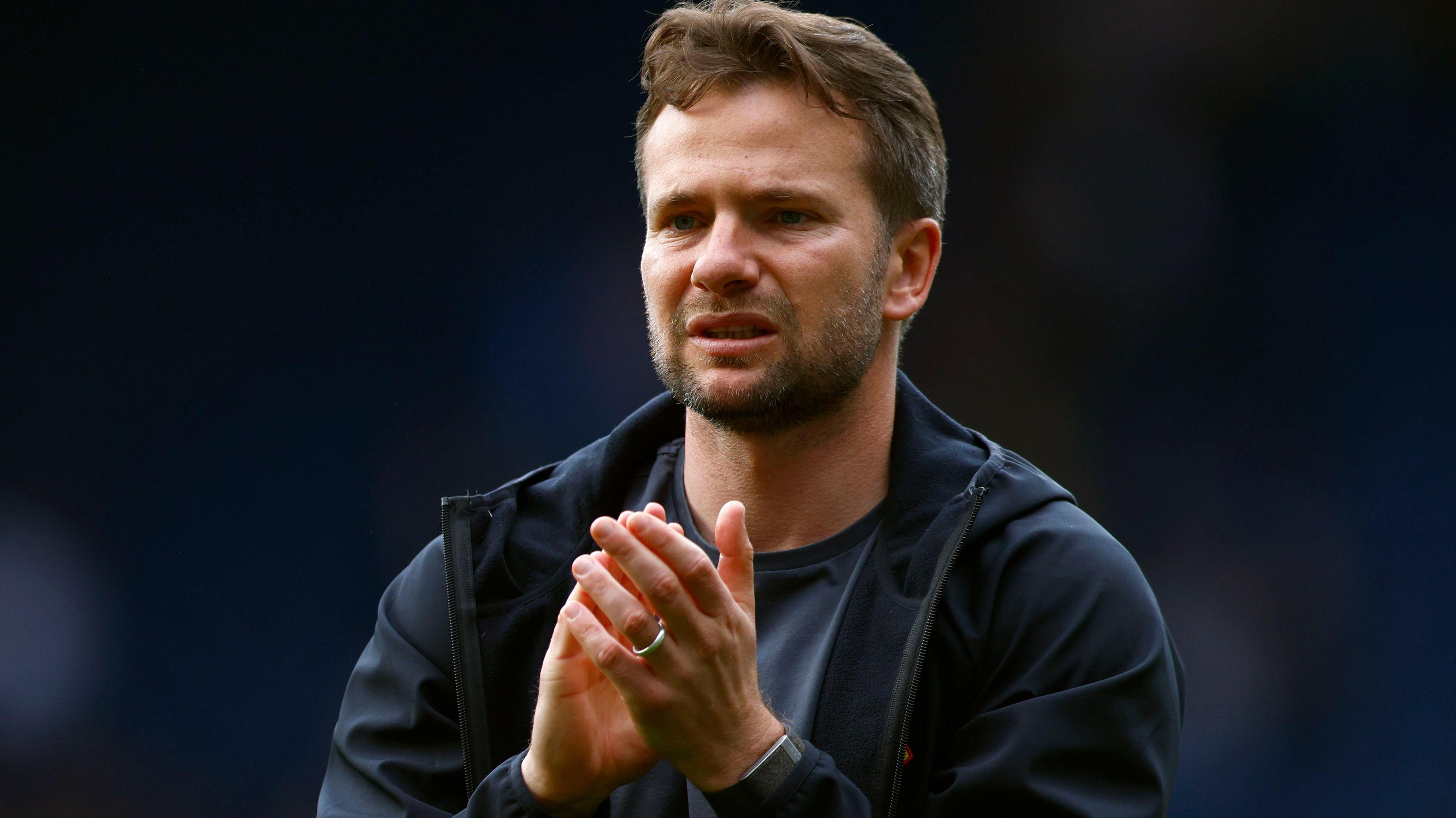 Tom Cleverley applauds