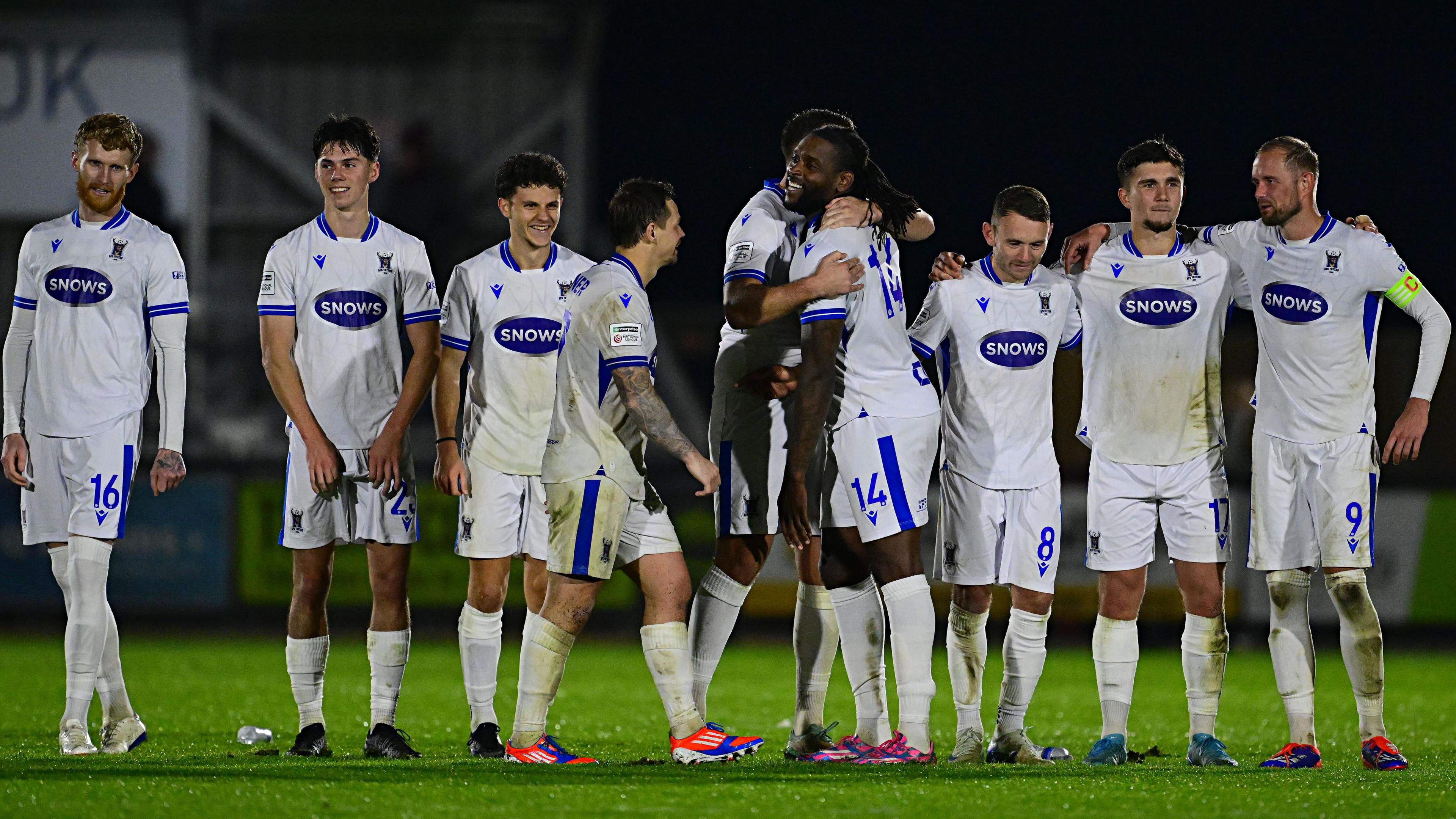 AFC Totton celebrate with Jay Emmanuel-Thomas