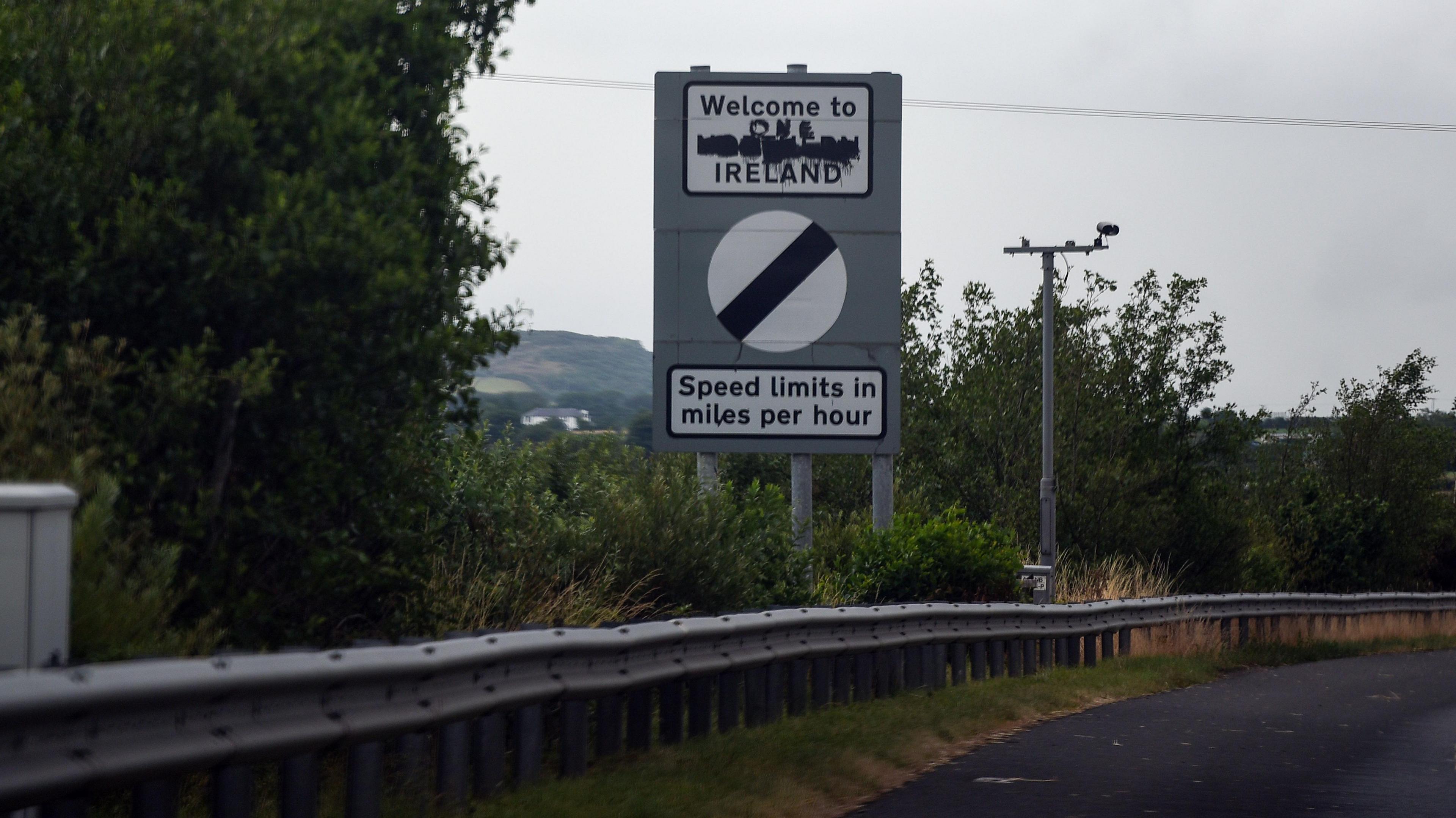 A Welcome to Northern Ireland road sign with Northern painted over