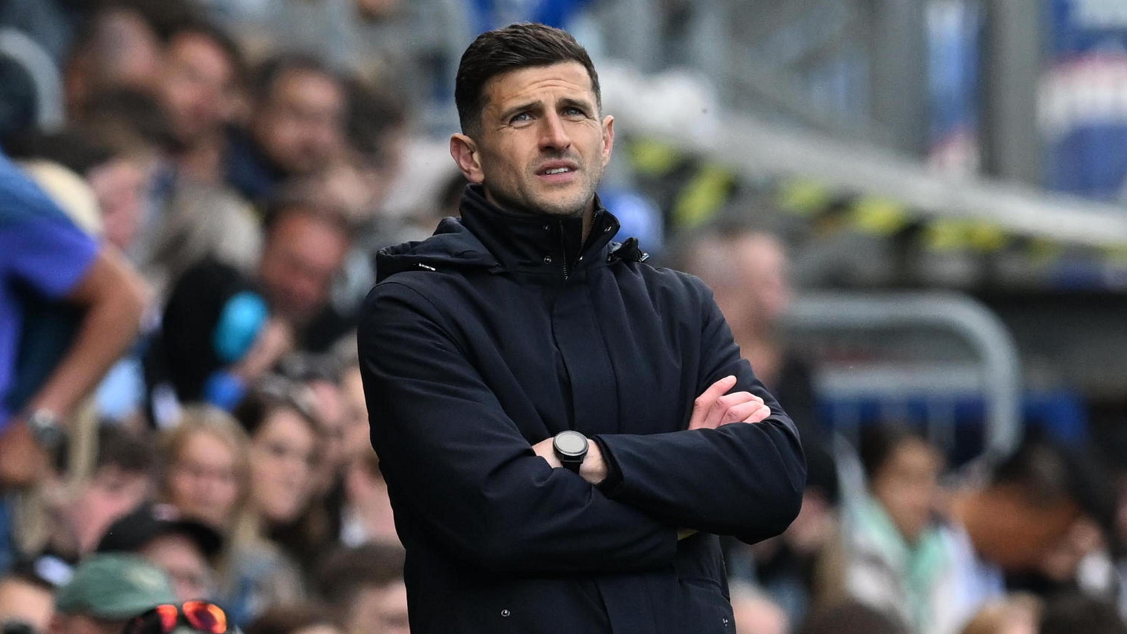 Portsmouth boss John Mousinho looks on from the sidelines