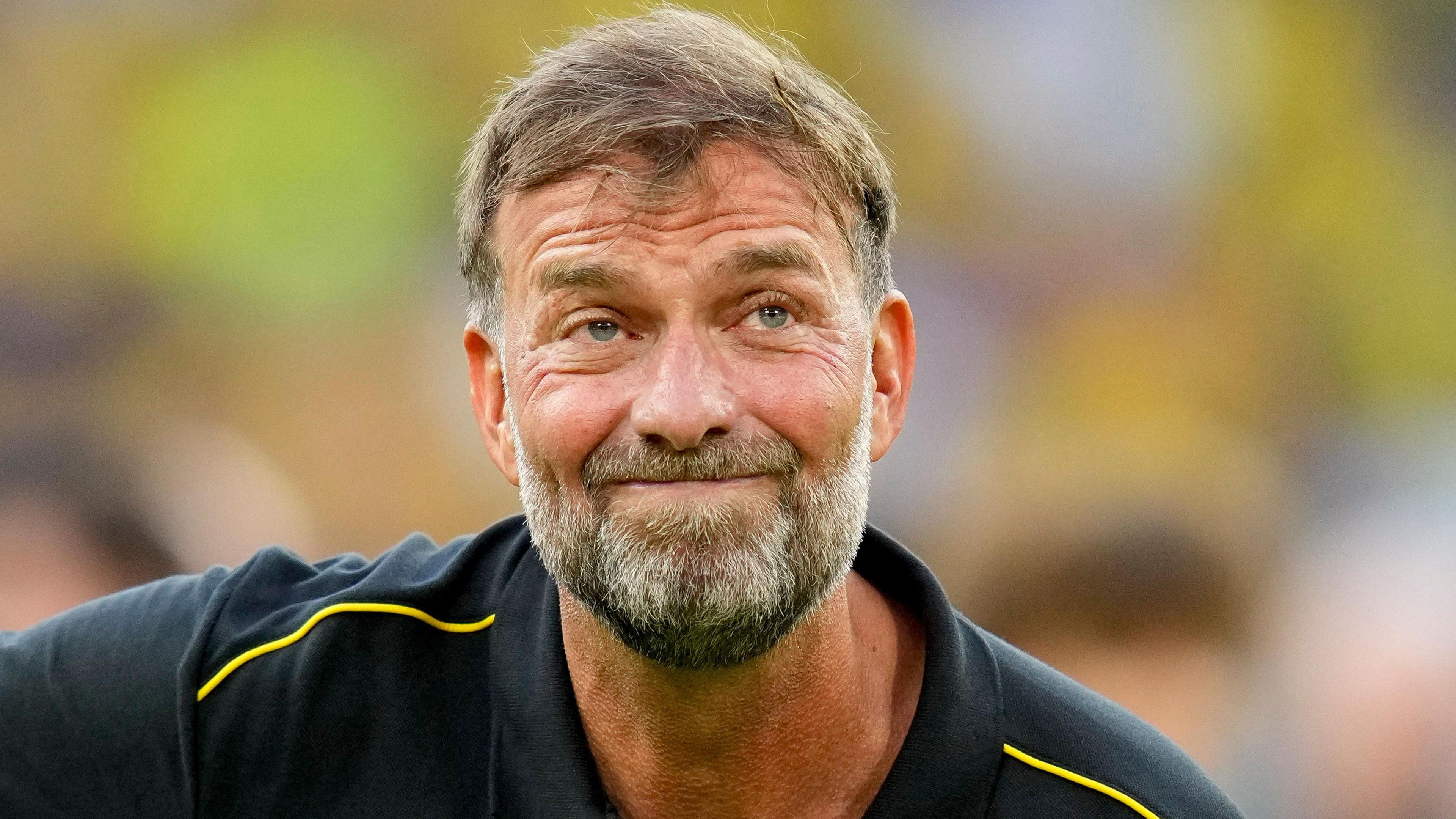 Jurgen Klopp stifles a smile during a Borussia Dortmund farewell match for Lukasz Piszczek and Jakub Blaszczykowski