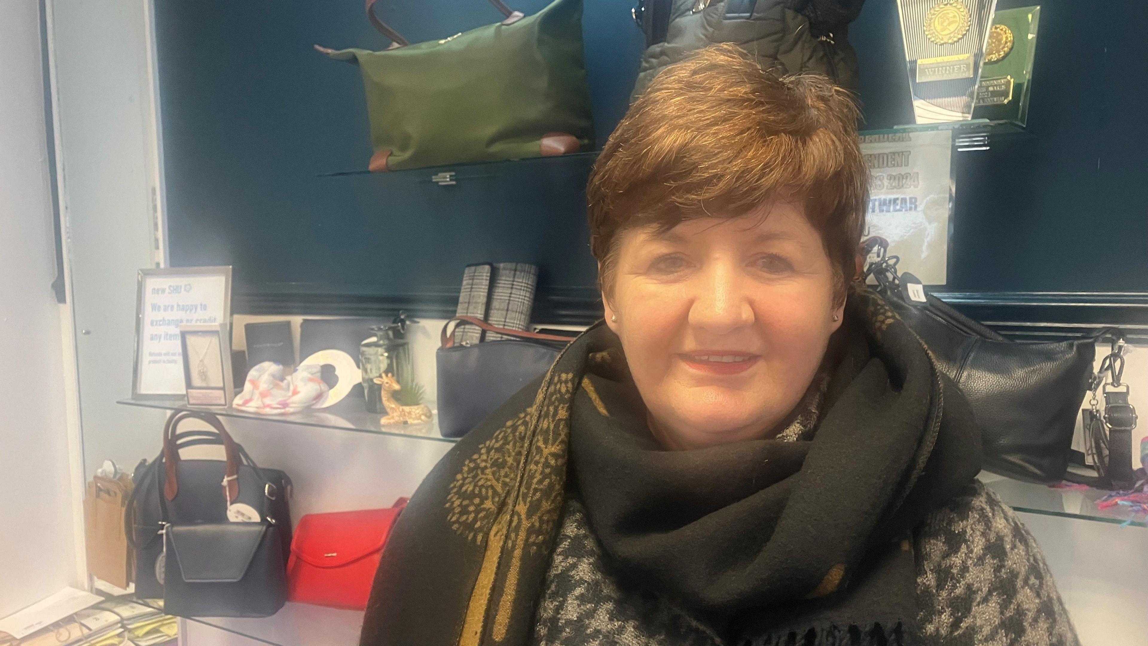 Photograph of shopkeeper inside her store in Ashton under Lyne